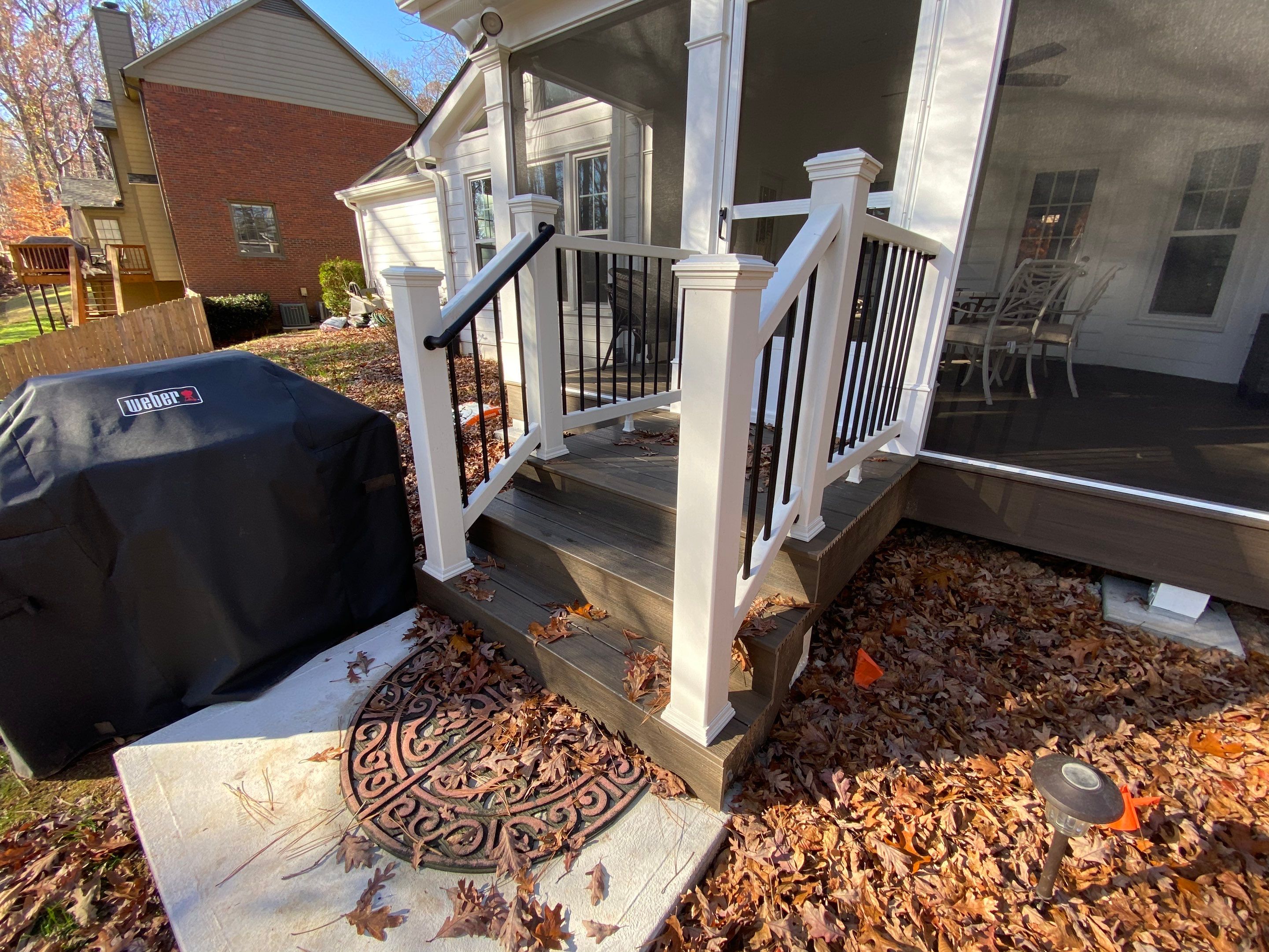 Custom Screened Porch with Beadboard Ceiling and Composite Decking by Swift Home Renovations