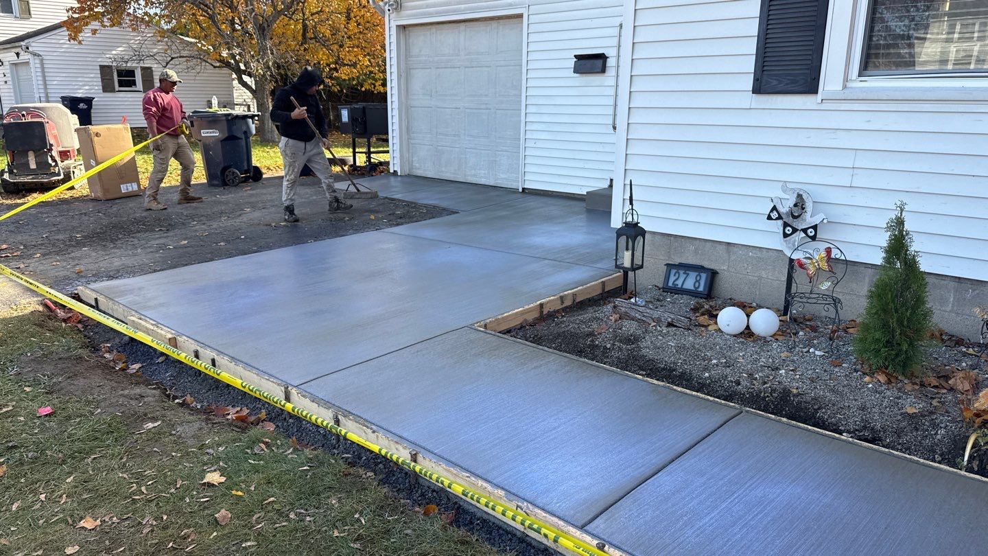 Broom finished concrete patio  by NG Masonry & Construction LLC