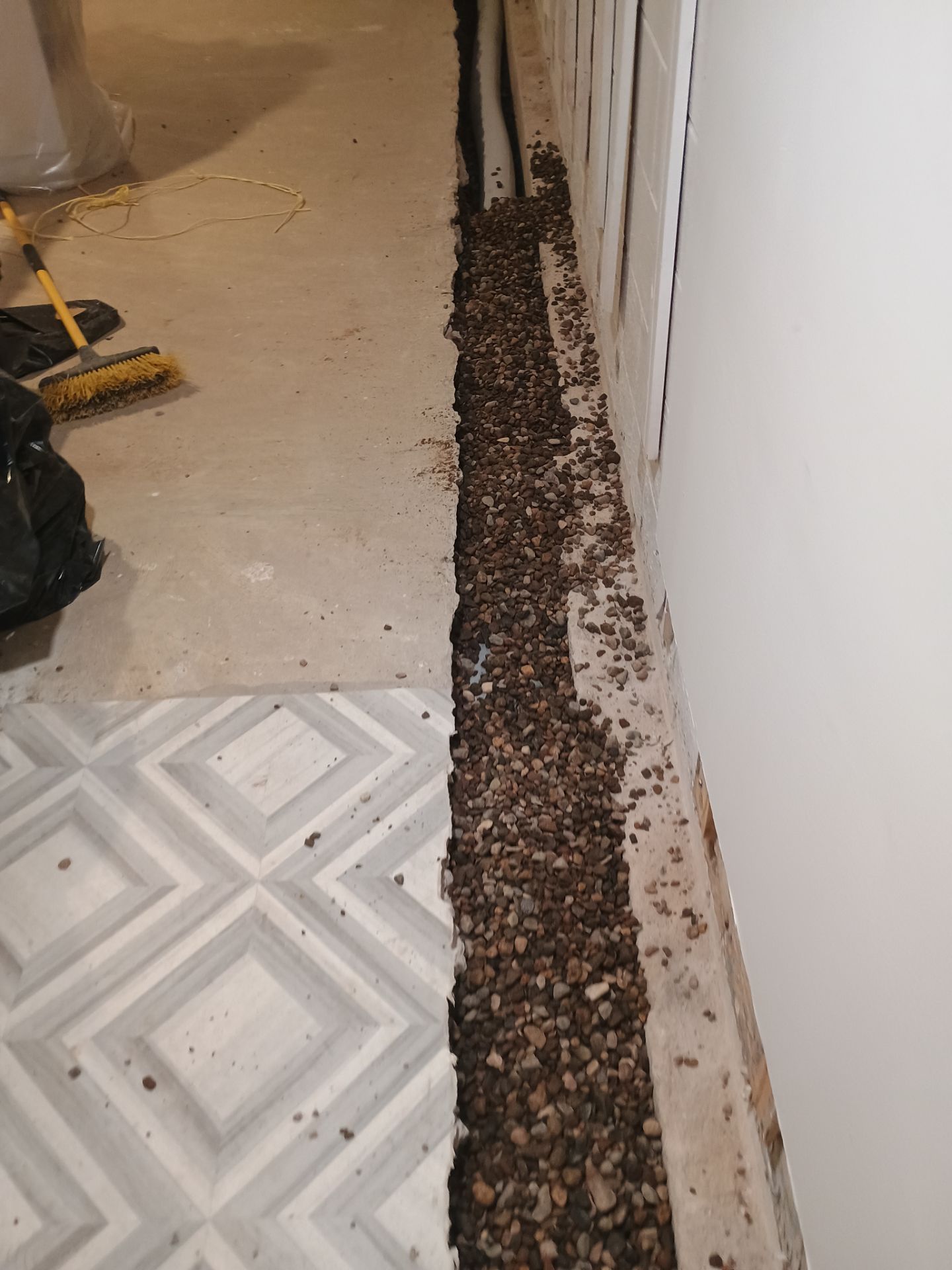 Interior Drain Tile & Buried Discharge in St. Anthony, MN by Waterproofing Northeast