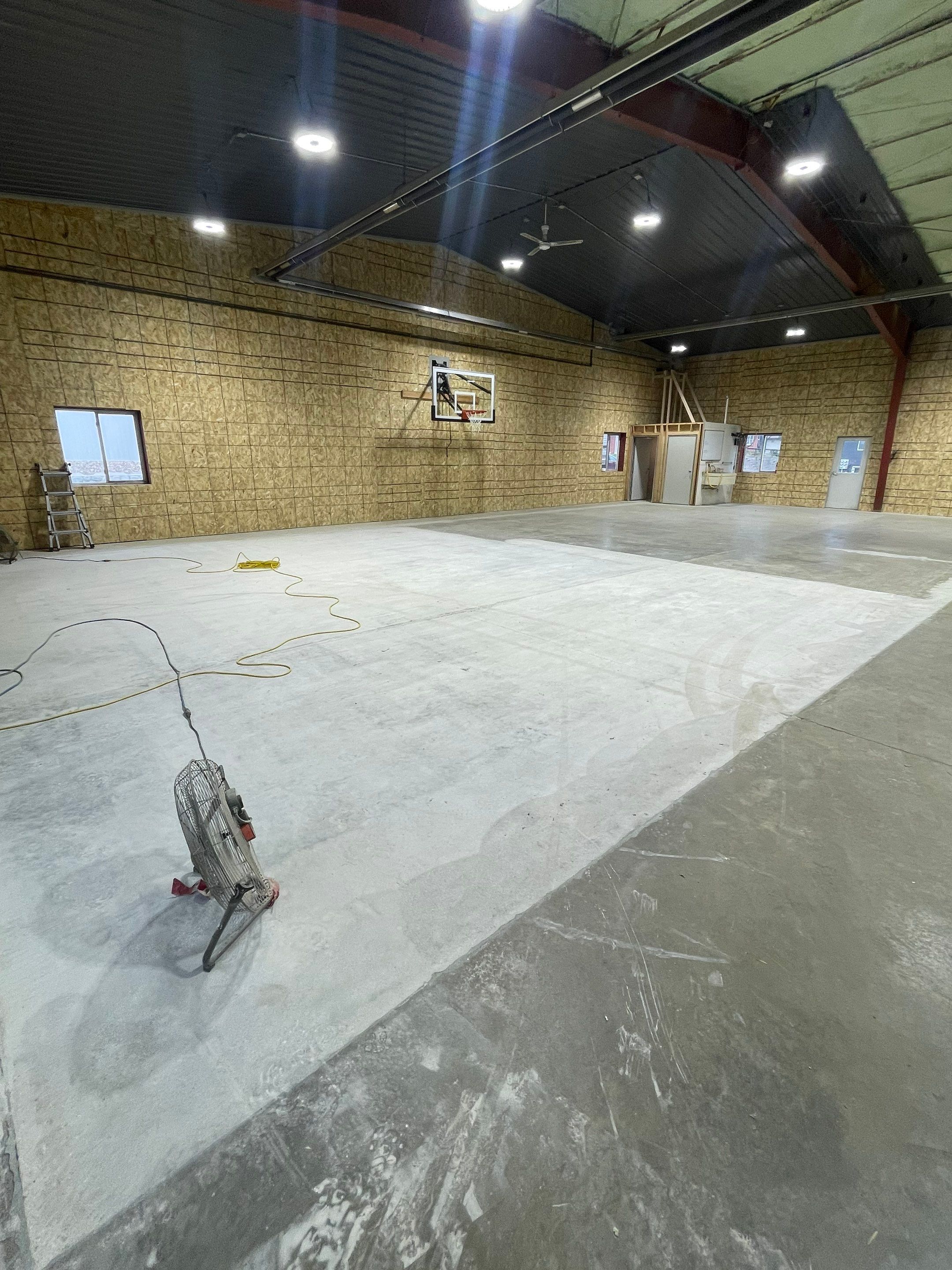 Custom Polyurea Shop Floor with Basketball Court Lines in Rock Valley by Select Painting, Coatings & Garage Cabinets