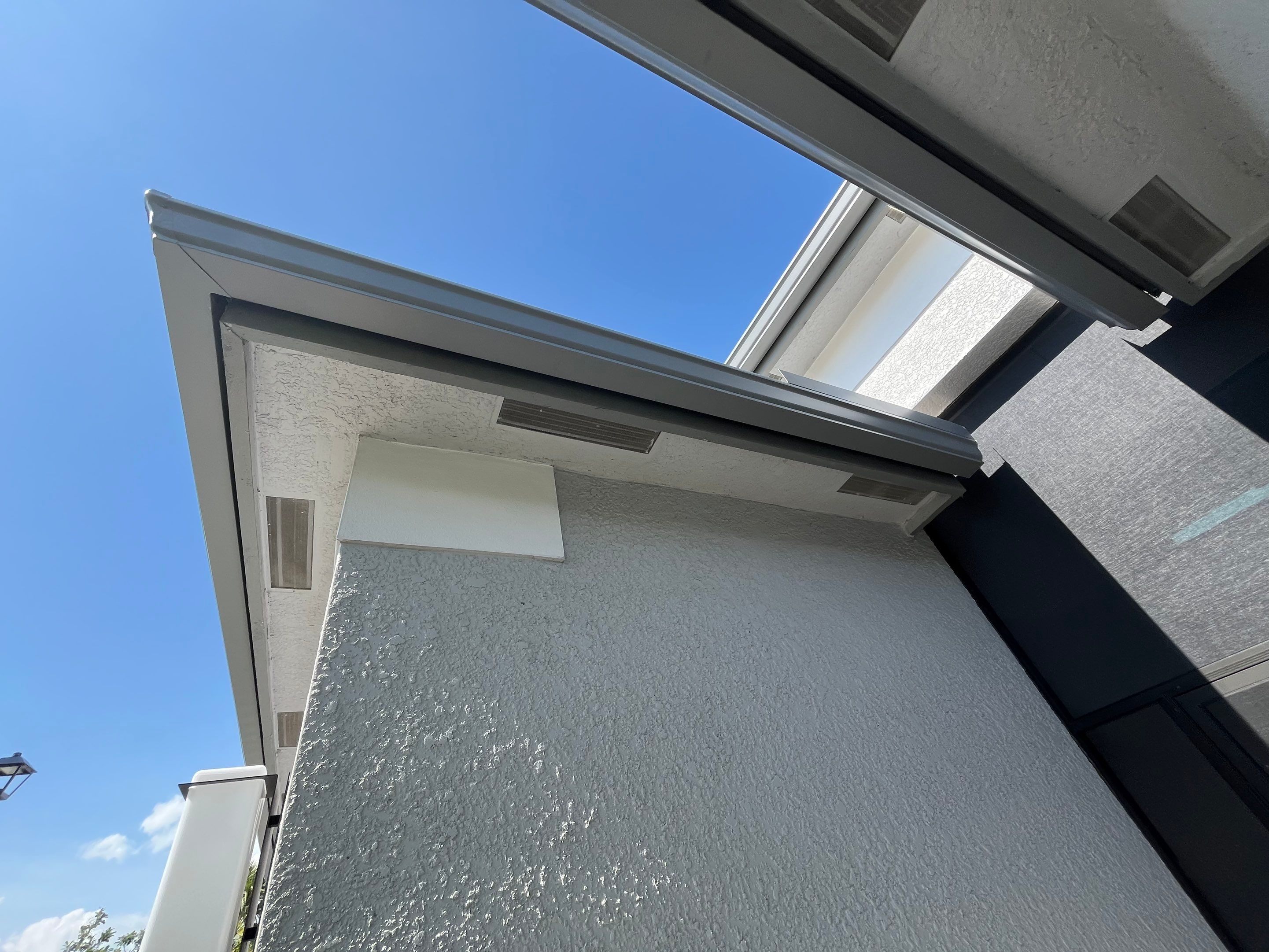 Grey Seamless Gutter Installation in Estero FL by Gutter Professors