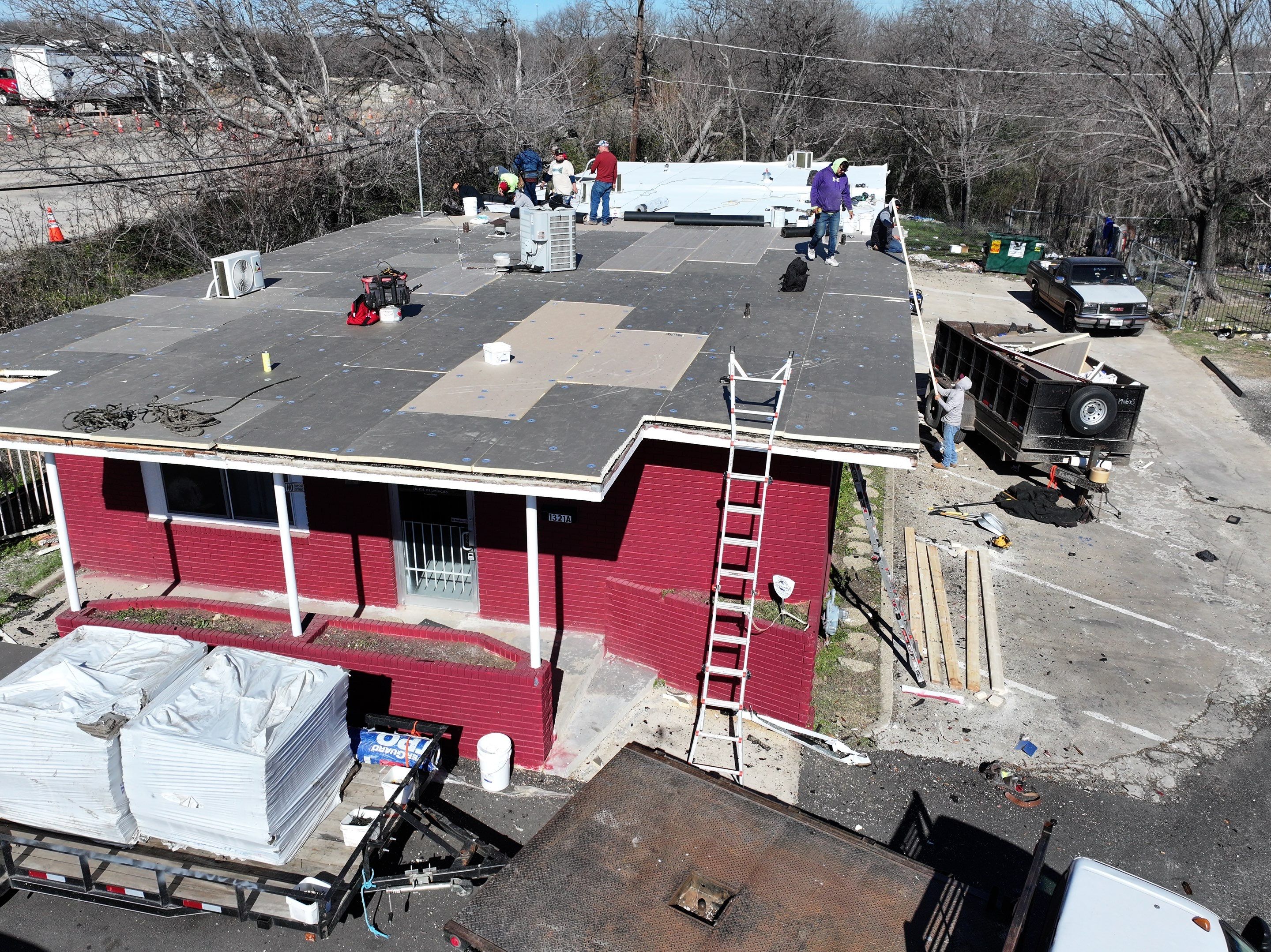 Commercial roofing overlay using GAF TPO over an old ballast roof by Becker Roofing and Exteriors