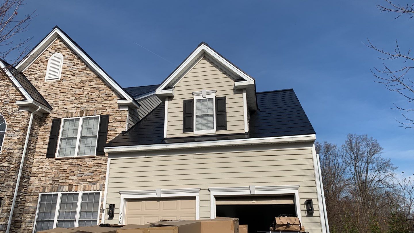 Tesla Solar Roof and Gutter Installation by American Home Contractors