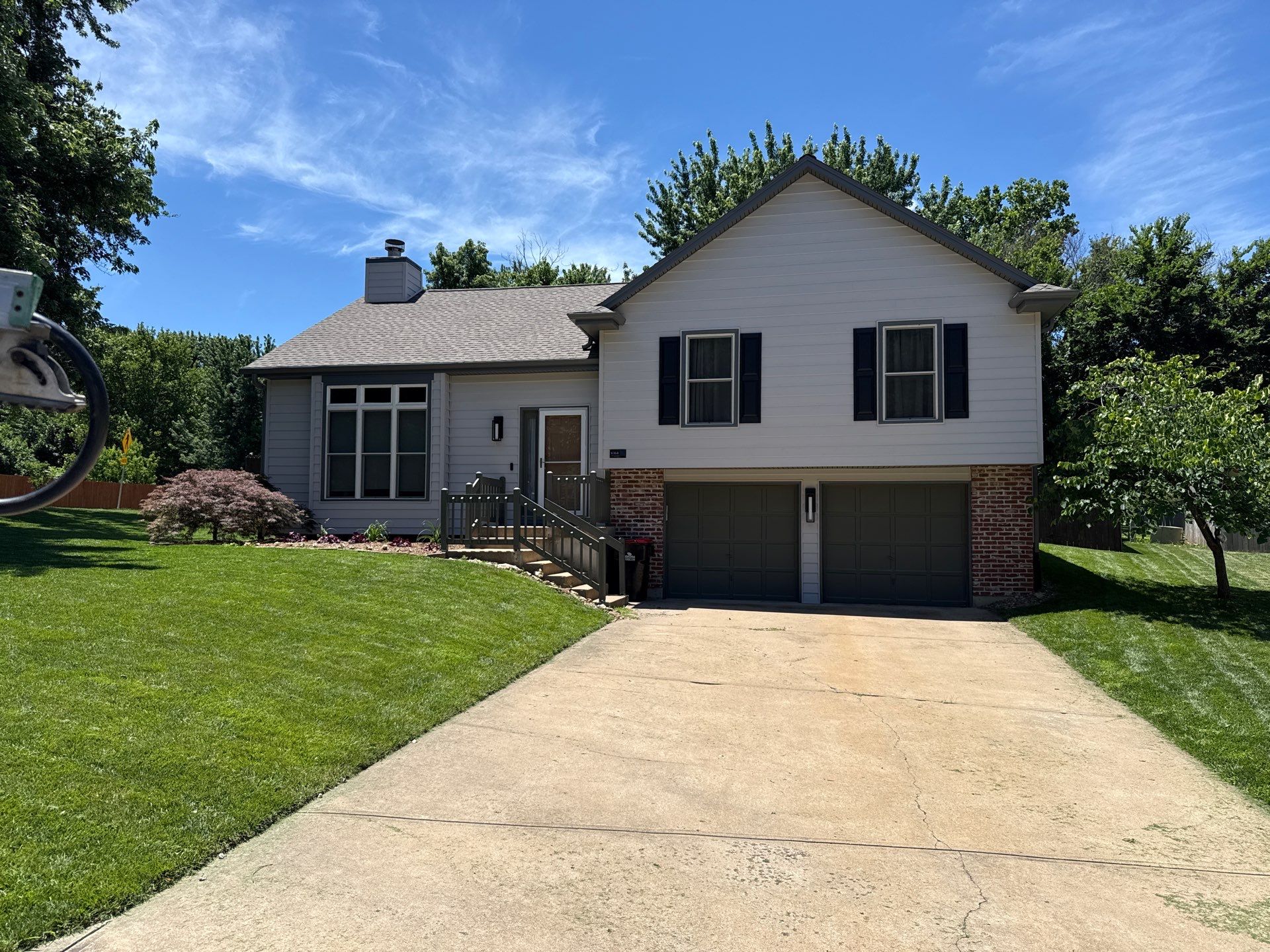 Whole-Home Craneboard Siding Replacement and Exterior Renovation in Shawnee by EEC Windows, Siding & Roofing