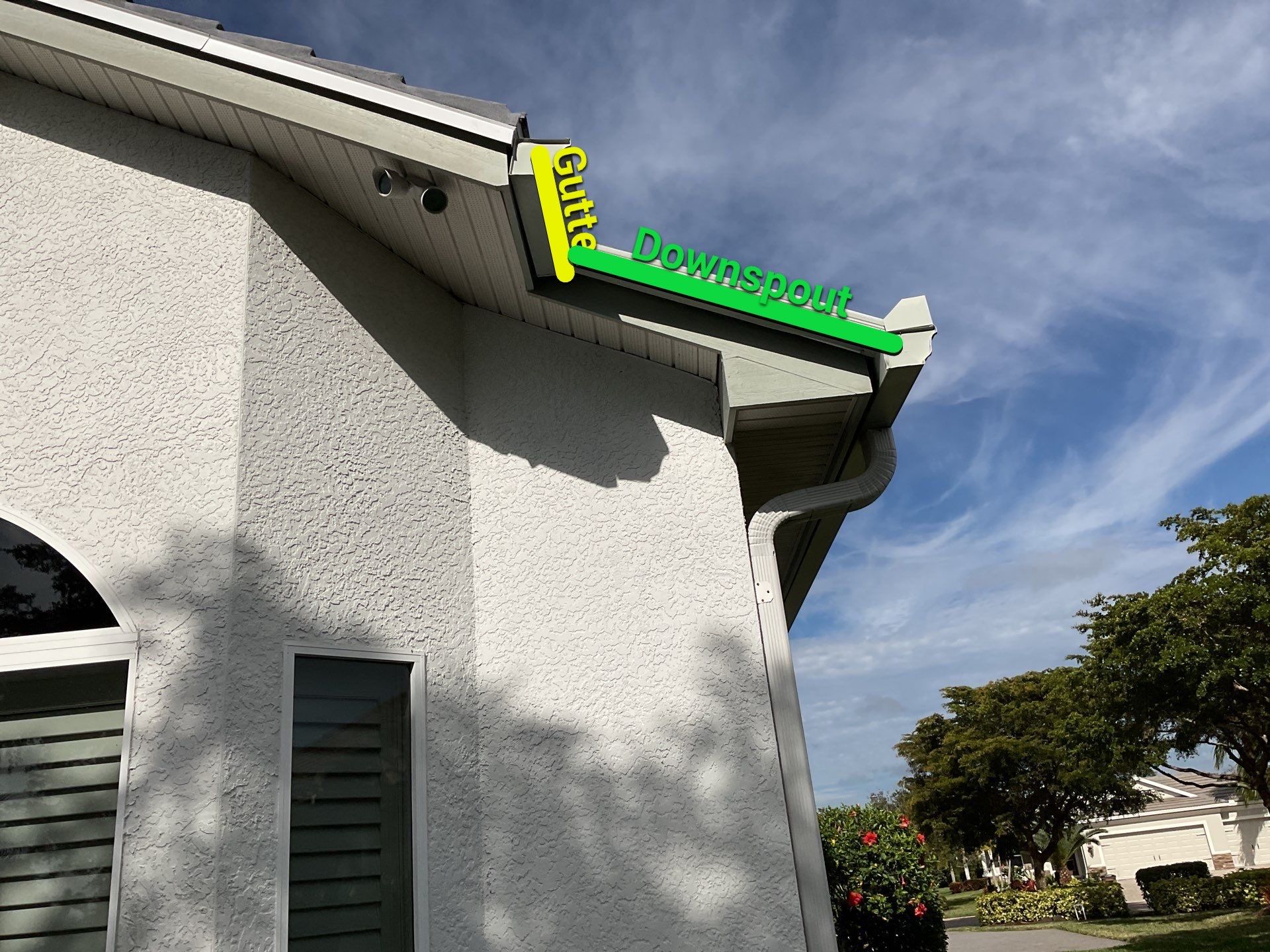 7-inch Grey Gutter Installation and White Downspouts in Fort Myers FL  by Gutter Professors