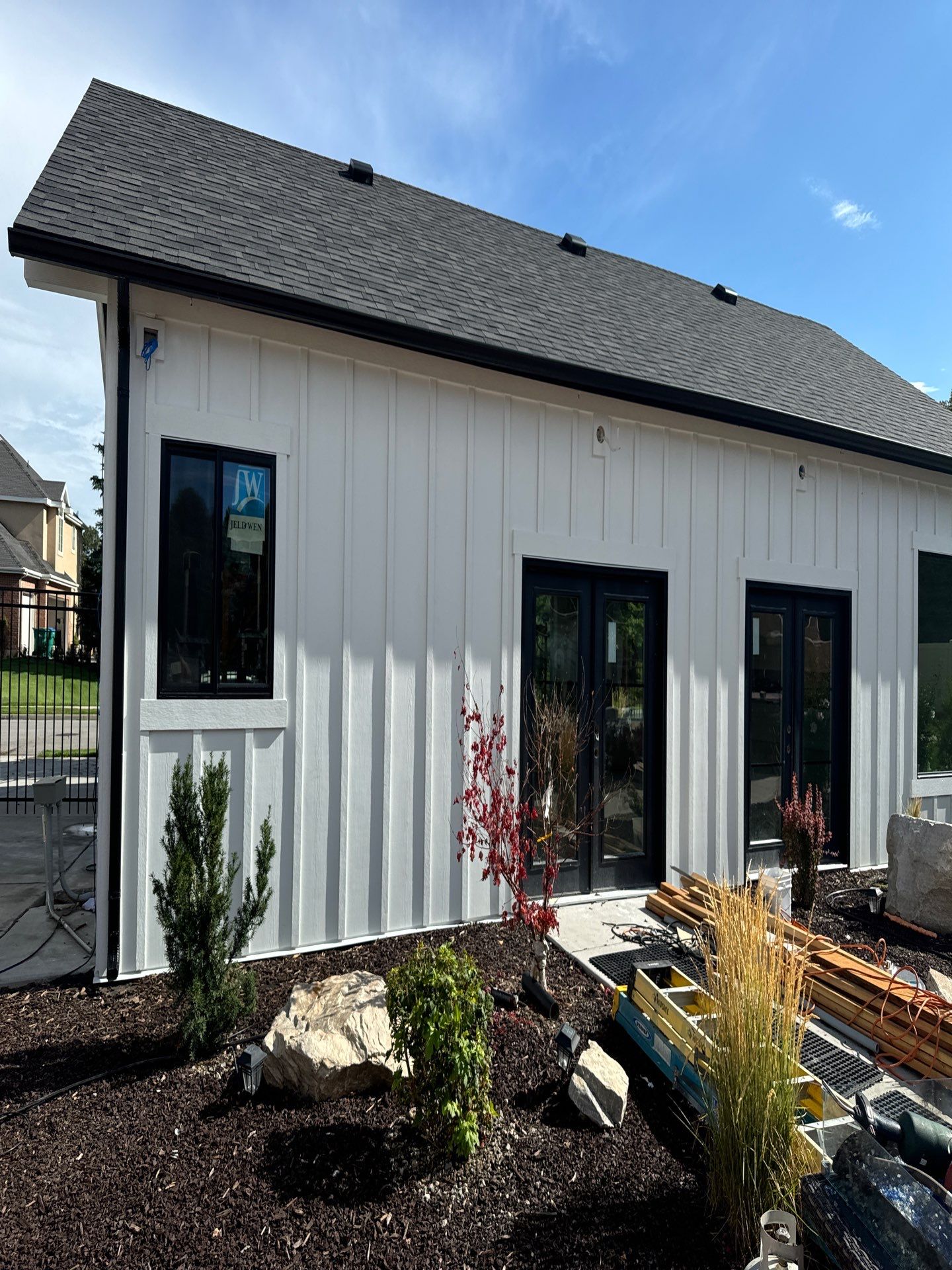 Highland | Modern Farmhouse Board & Batten | Arctic White & Black by Ideal Siding Utah