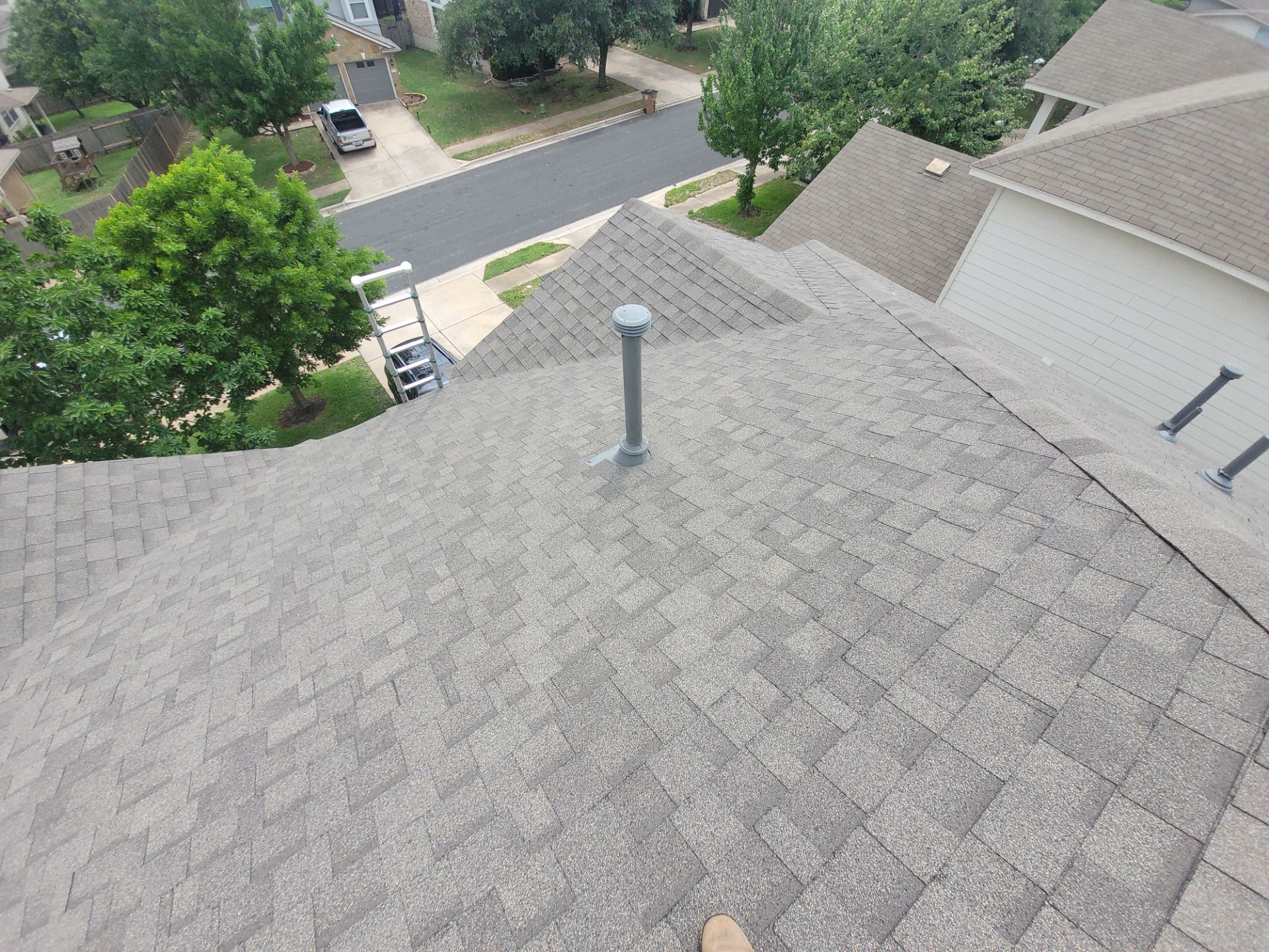 Residential Roofing Installation using IKO, Cambridge and gutters by Oakwood Roofing and Construction, LLC