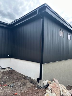 Matte Black Gutter and Downspout Installation in East Jordan