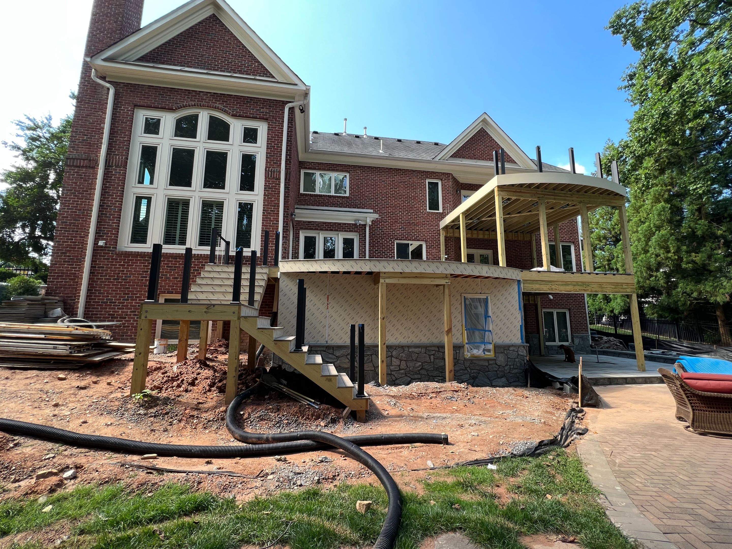 Custom Multi-Level Deck, Outdoor Kitchen & Pool Patio in McLean, VA by Sunburst Construction Inc