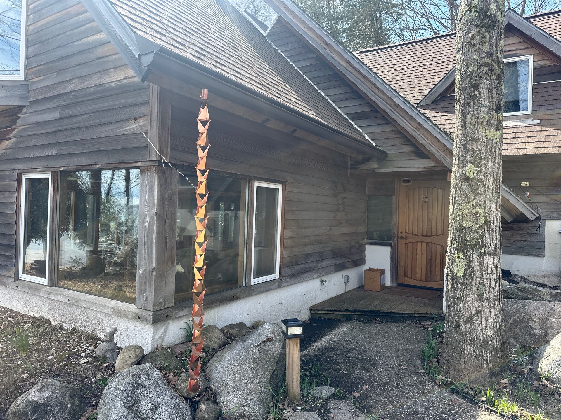 Gutter, Gutter Helmet and Copper Rain Chain Installation in Suttons Bay by Rainbow Seamless Systems