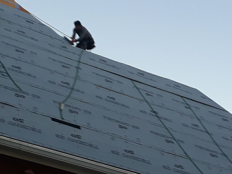 Residential Roofing Installation using Roof Replacement by American Roofing & Construction LLC