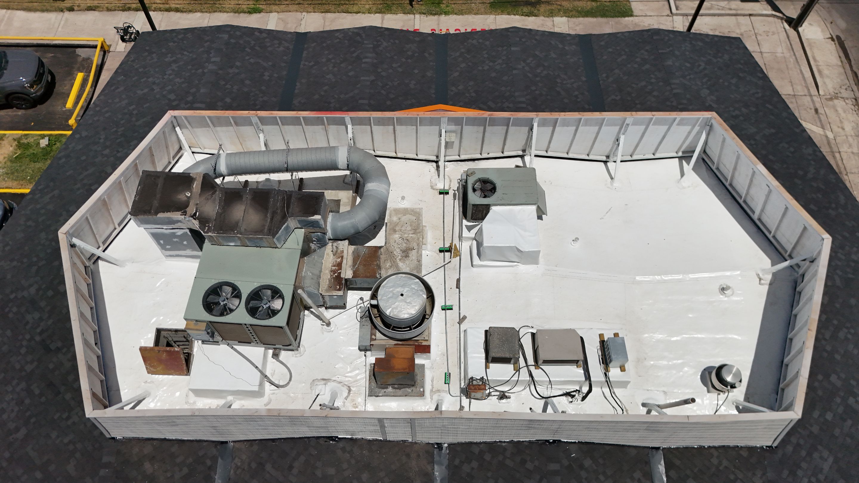 Commercial Asphalt Shingle and Flat Roof Installation in Laredo by JM Flores Roofing & Construction, Inc