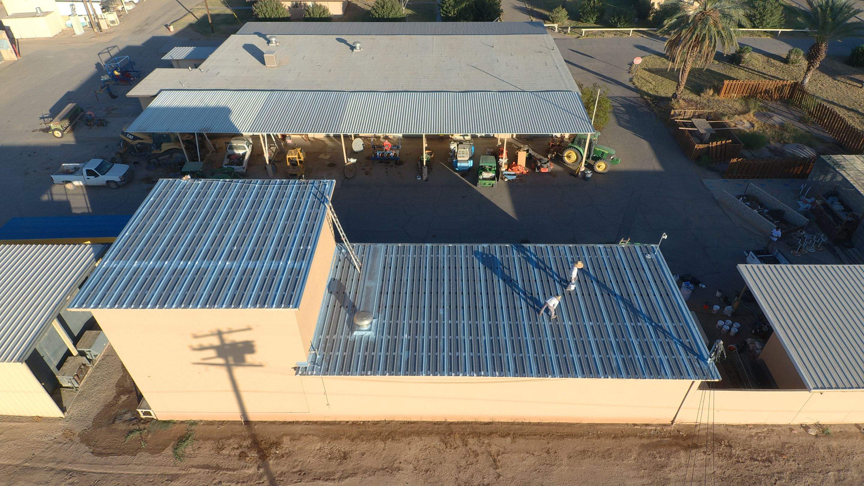 Metal roof restoration on commercial roof using Conklin Benchmark/PUMA XL fabric and coating by Straight Edge Roofing Inc