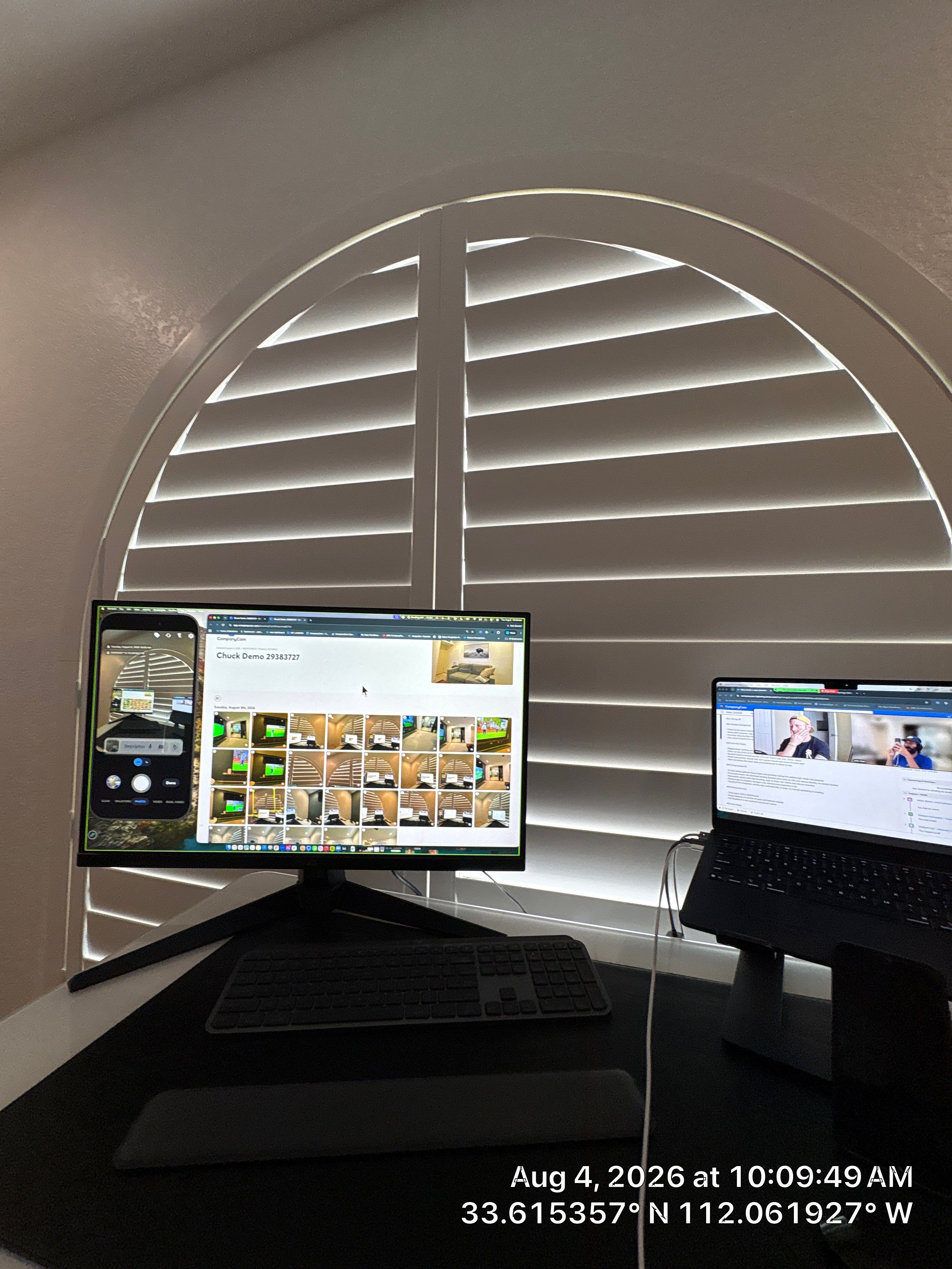 Custom Home Office Setup Featuring Arched Plantation Shutters and Accent Wall by CompanyCam Sales Demo