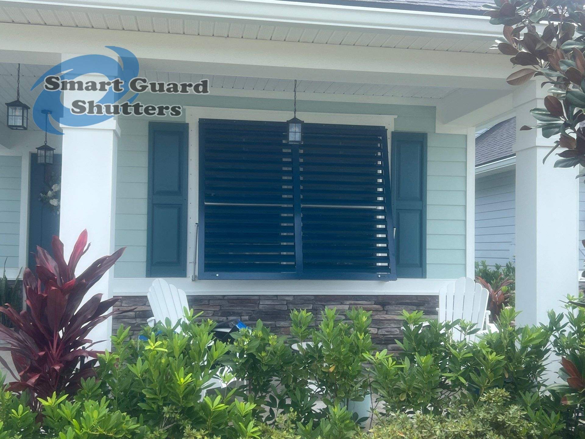 Impact Bahama Shutters in Ocean Blue by Smart Guard Shutters