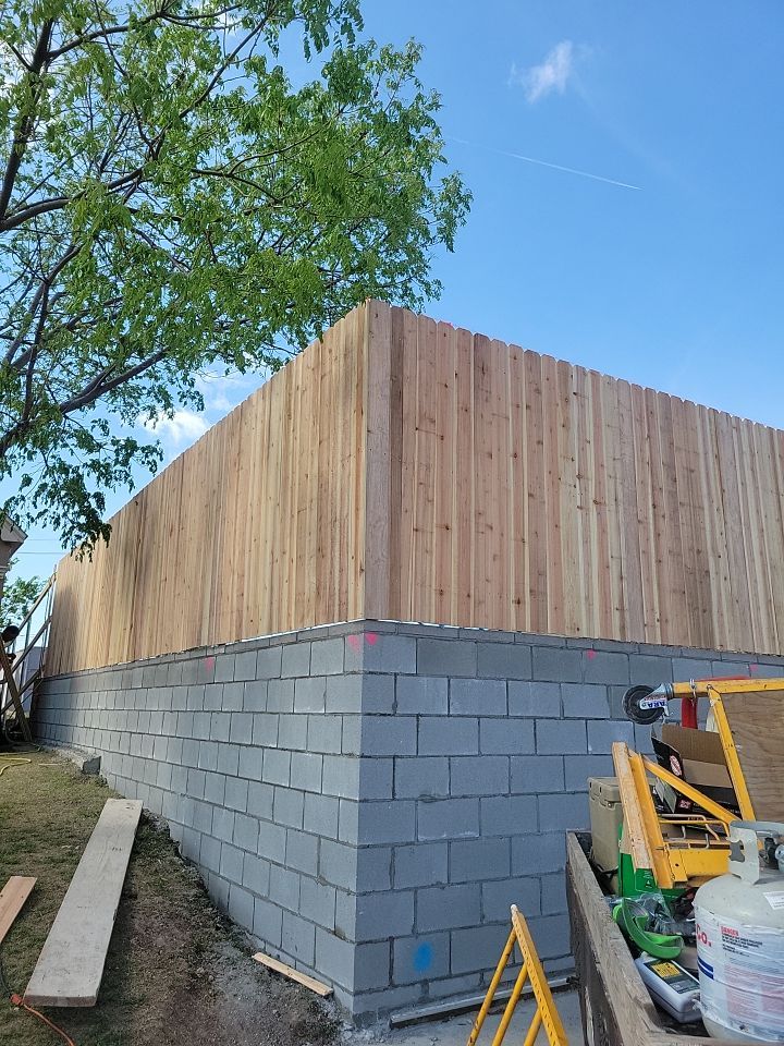 Cedar Fence using Cedar Pickets and Metal Poles by Clays Services Inc