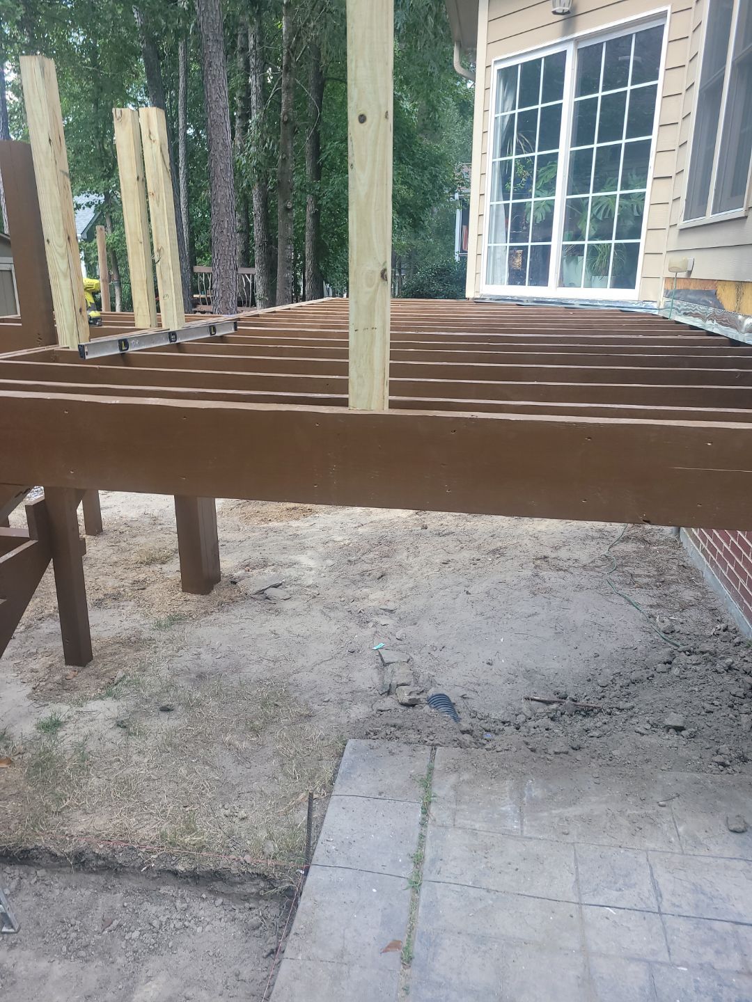 Fuquay-Varina Outdoor Upgrade – Composite Deck & Paved Landing by Elite Remodeling and Design LLC