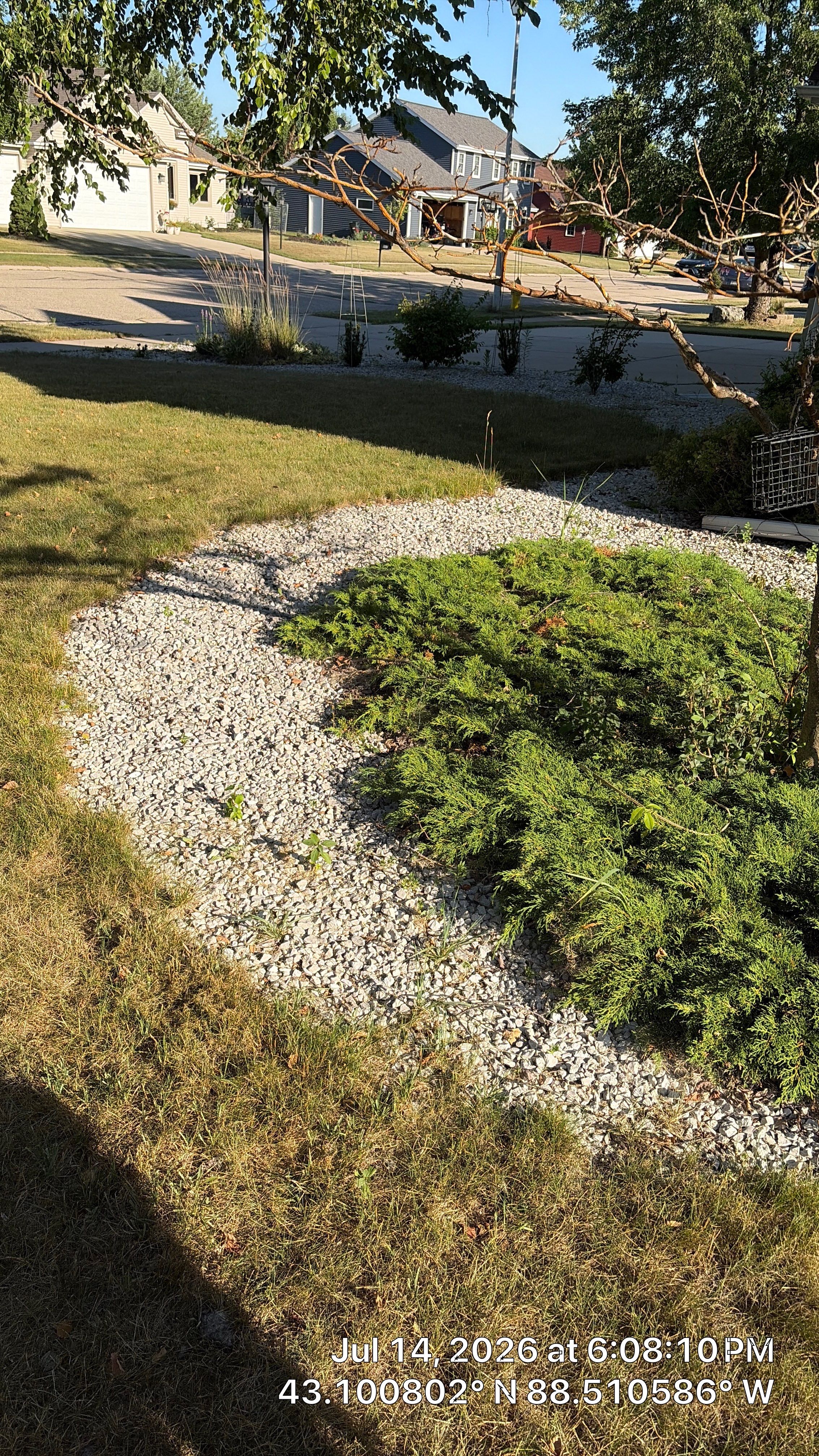 Decorative Stone and River Rock Landscaping for Oconomowoc Residence by CompanyCam Sales Demo
