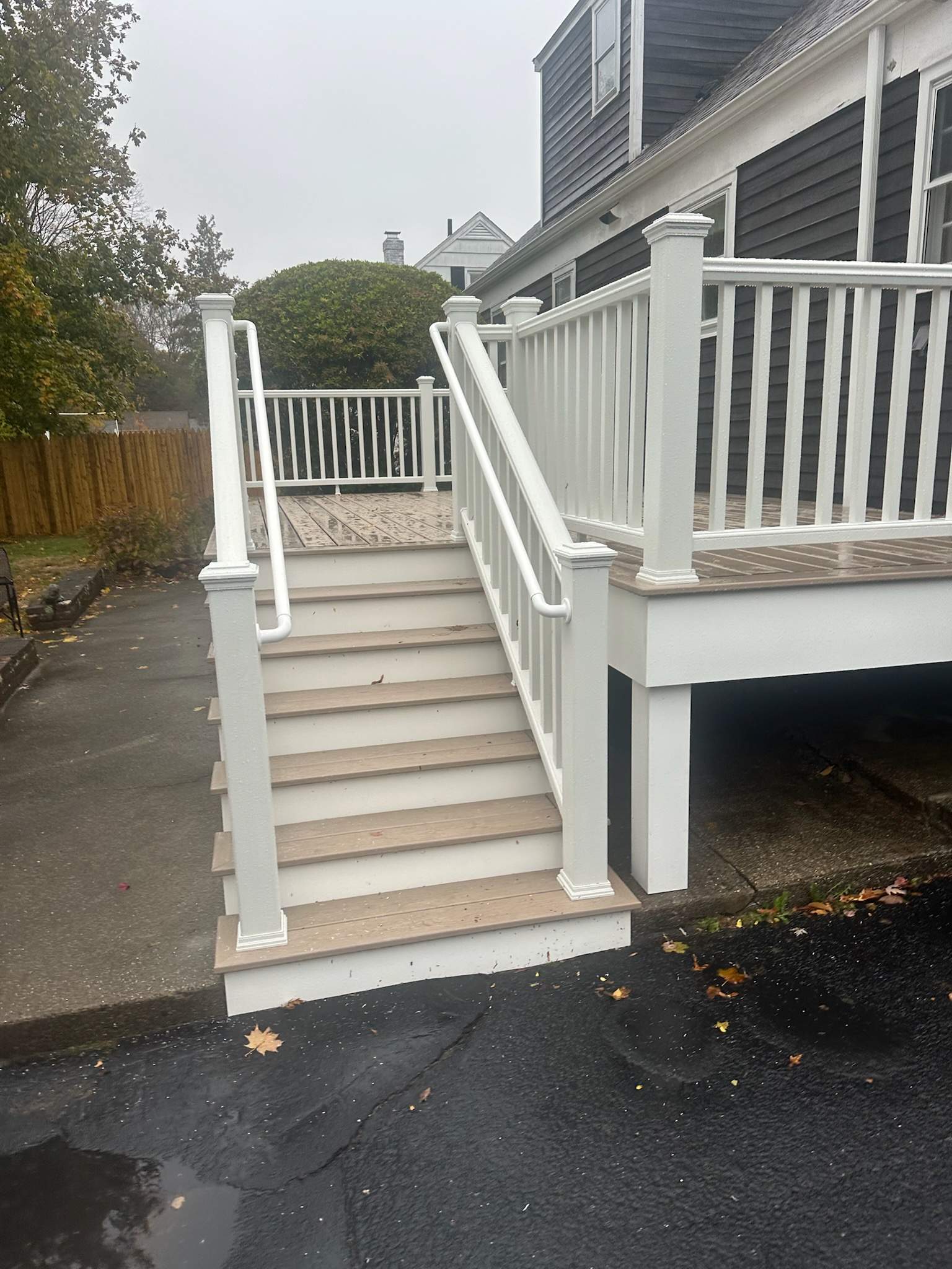 Deck replacement, using Trex Transcend Rope Swing, Transcend railings with ada graspable handrail. in white. by DiGiorgi Roofing and Siding Inc