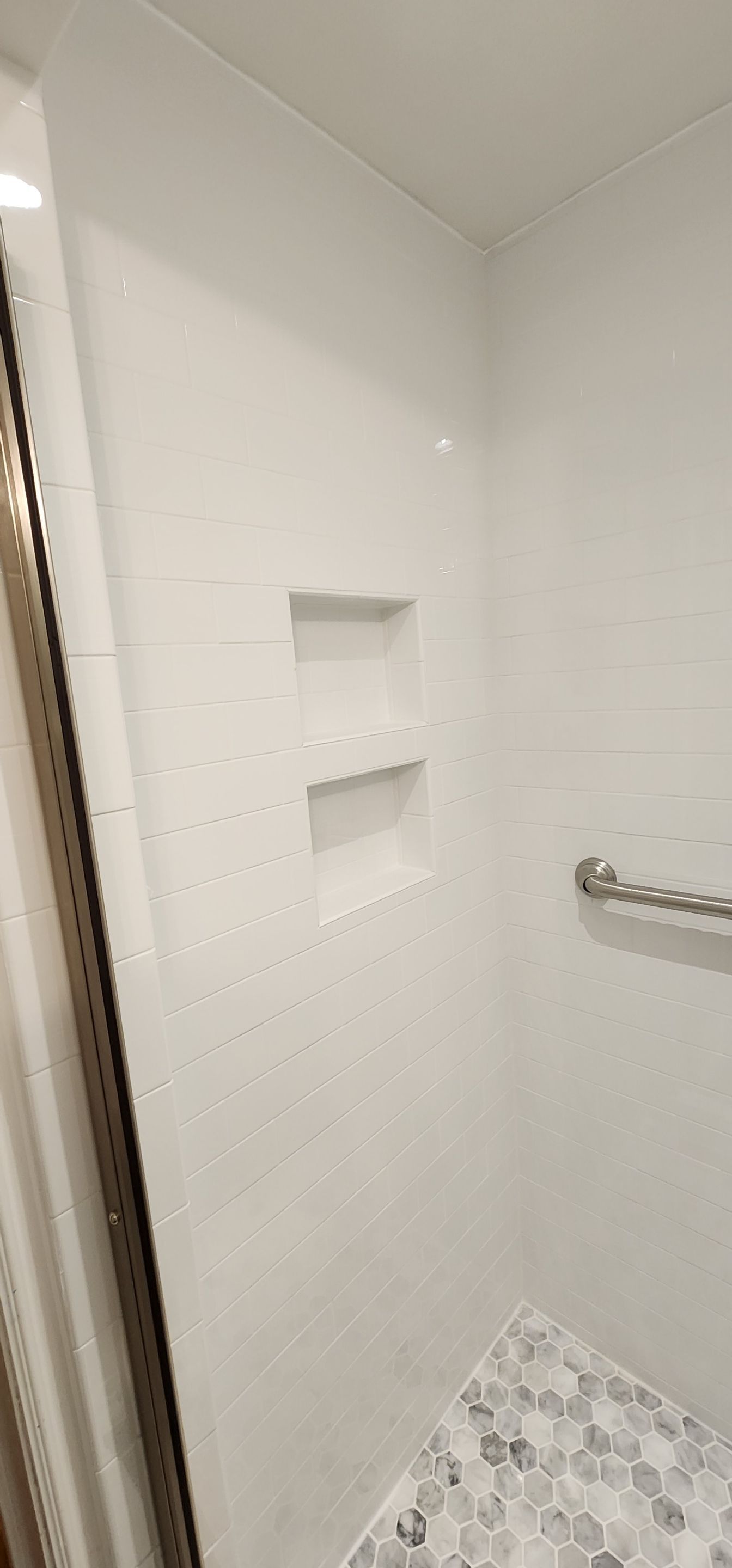 Full bathroom, tile shower, tile floor, tile wainscoting by The Shower Company