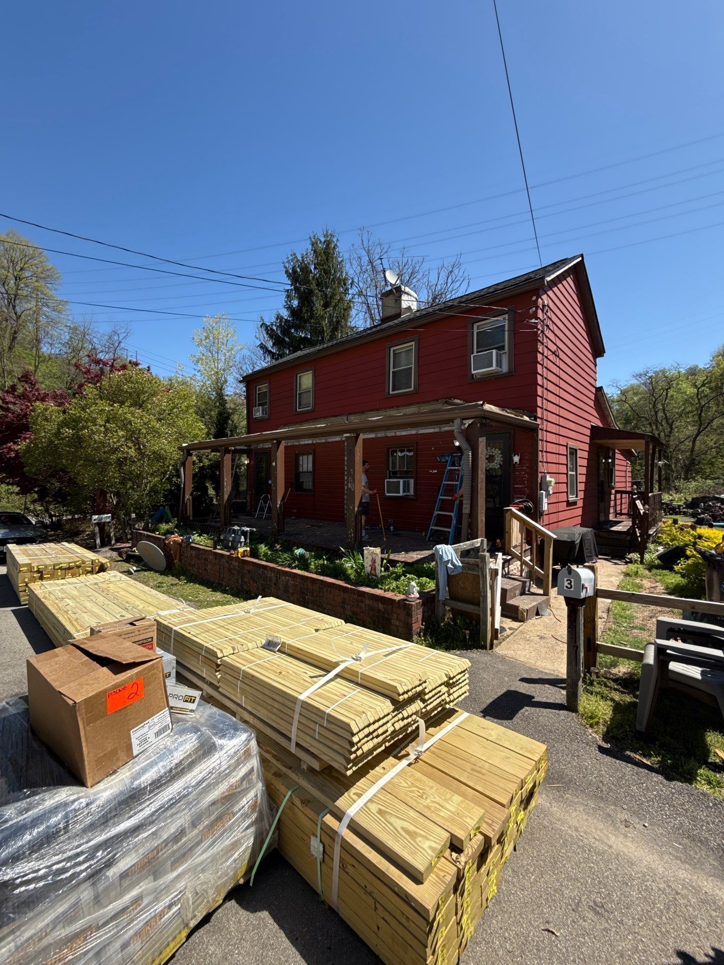 Roof sunspace deck  by Cousins Roofing Siding & Decks