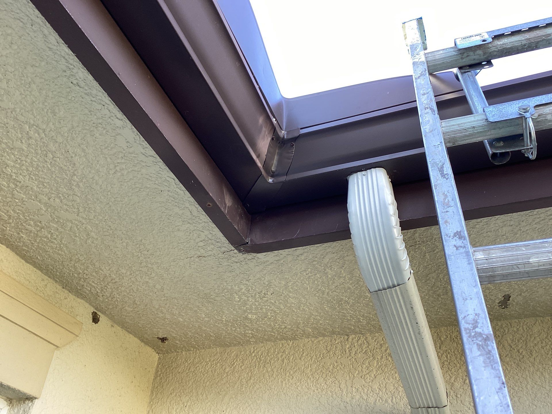 Musket Brown Seamless Gutters using Musket Brown Seamless Gutters in Capen Coral FL by Gutter Professors