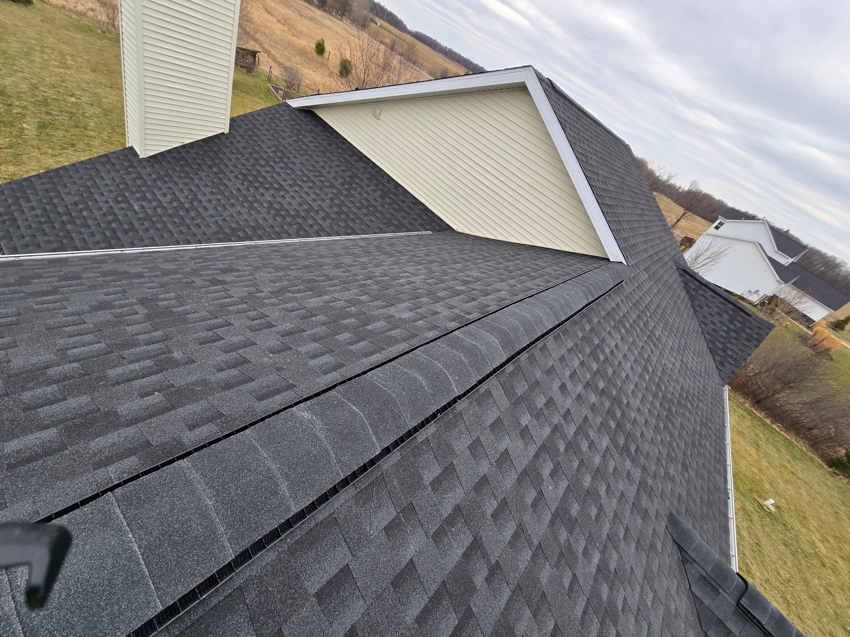 Re-roofing with GAF Timberline HDZ Shingles in Charcoal by Acme Exteriors