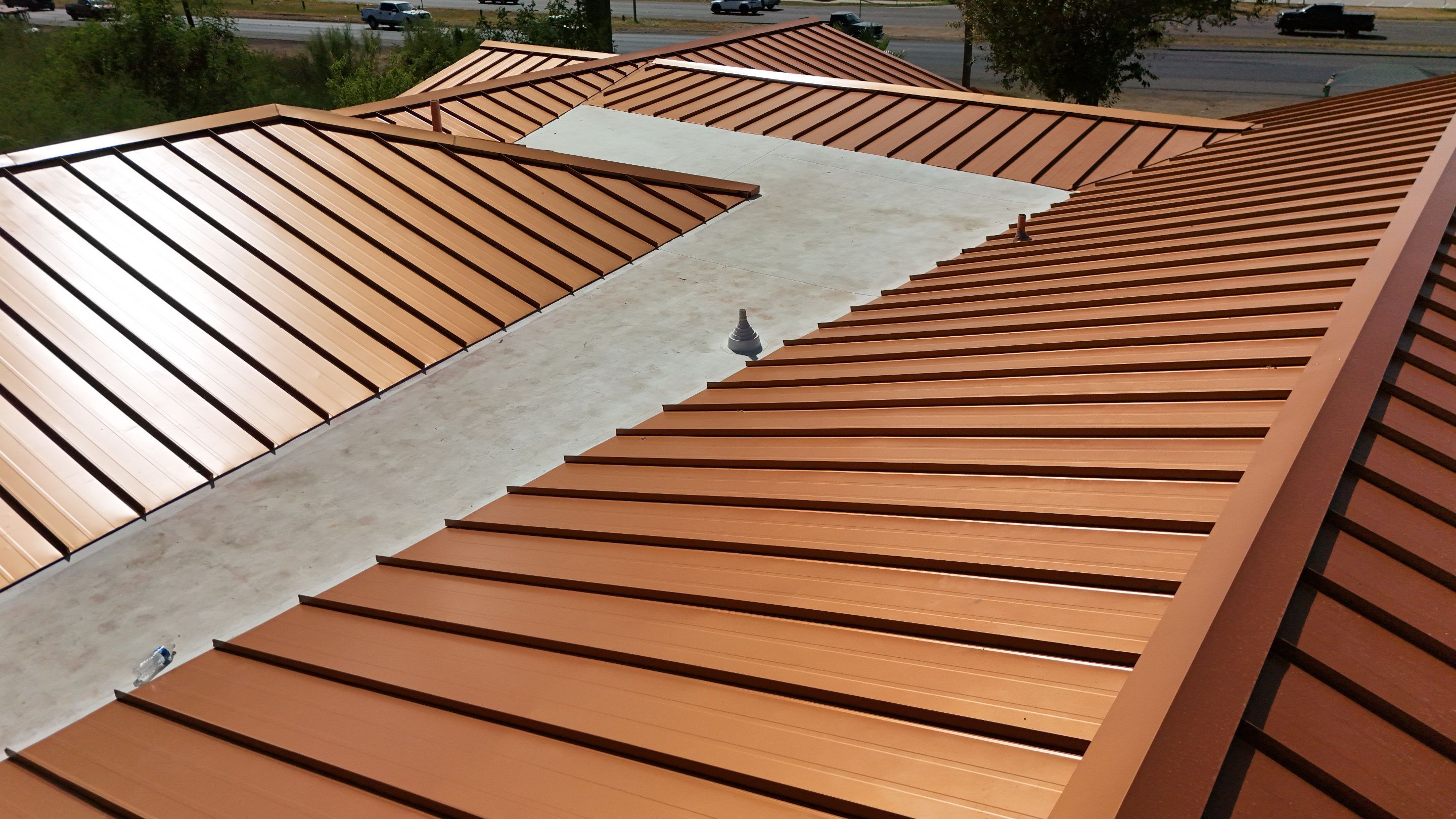 Copper Standing Seam Metal Roof Installation for Laredo Medical Clinic by JM Flores Roofing & Construction, Inc