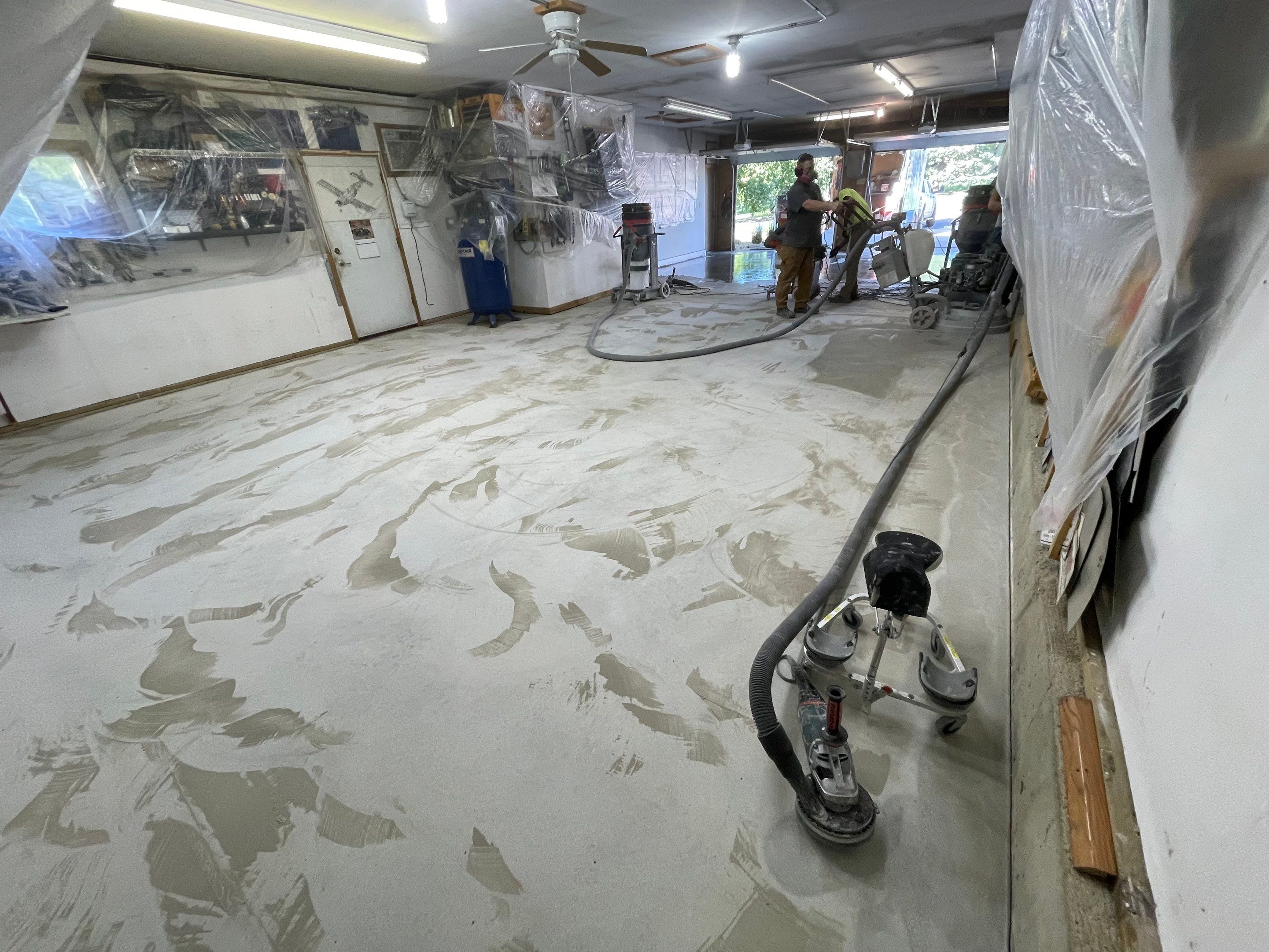 High-Performance Polyurea Garage Floor Coating and Stem Wall Finishing in Sioux Falls by Select Painting, Coatings & Garage Cabinets