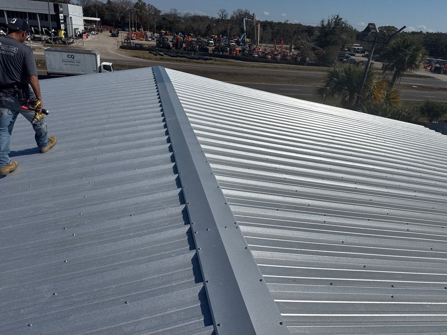 Commercial Metal Roof Replacement for Industrial Warehouses in Orlando by Tip Top Roofing Co., Inc.