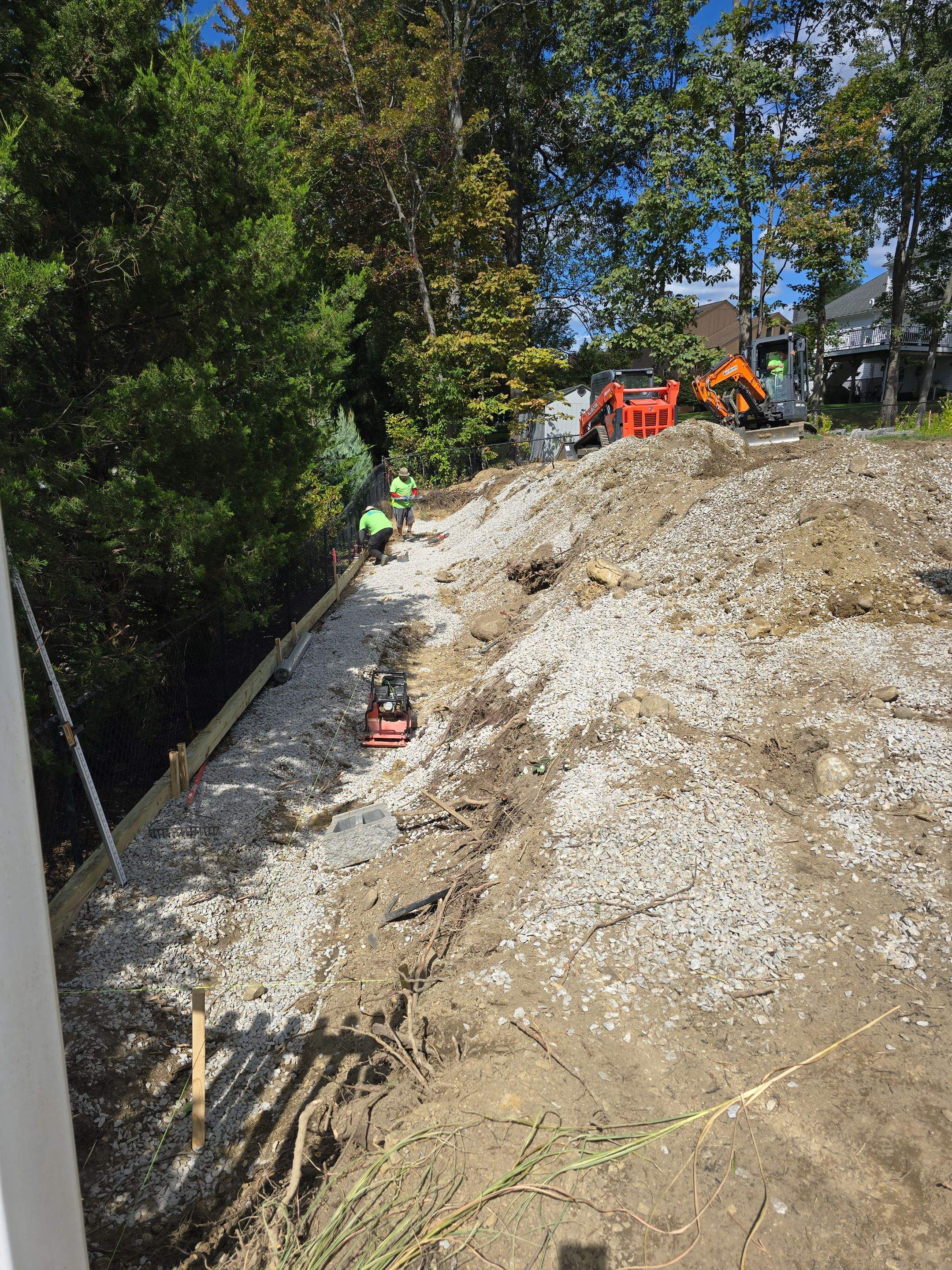 Retaining Wall to Level Backyard  by May Property Management 