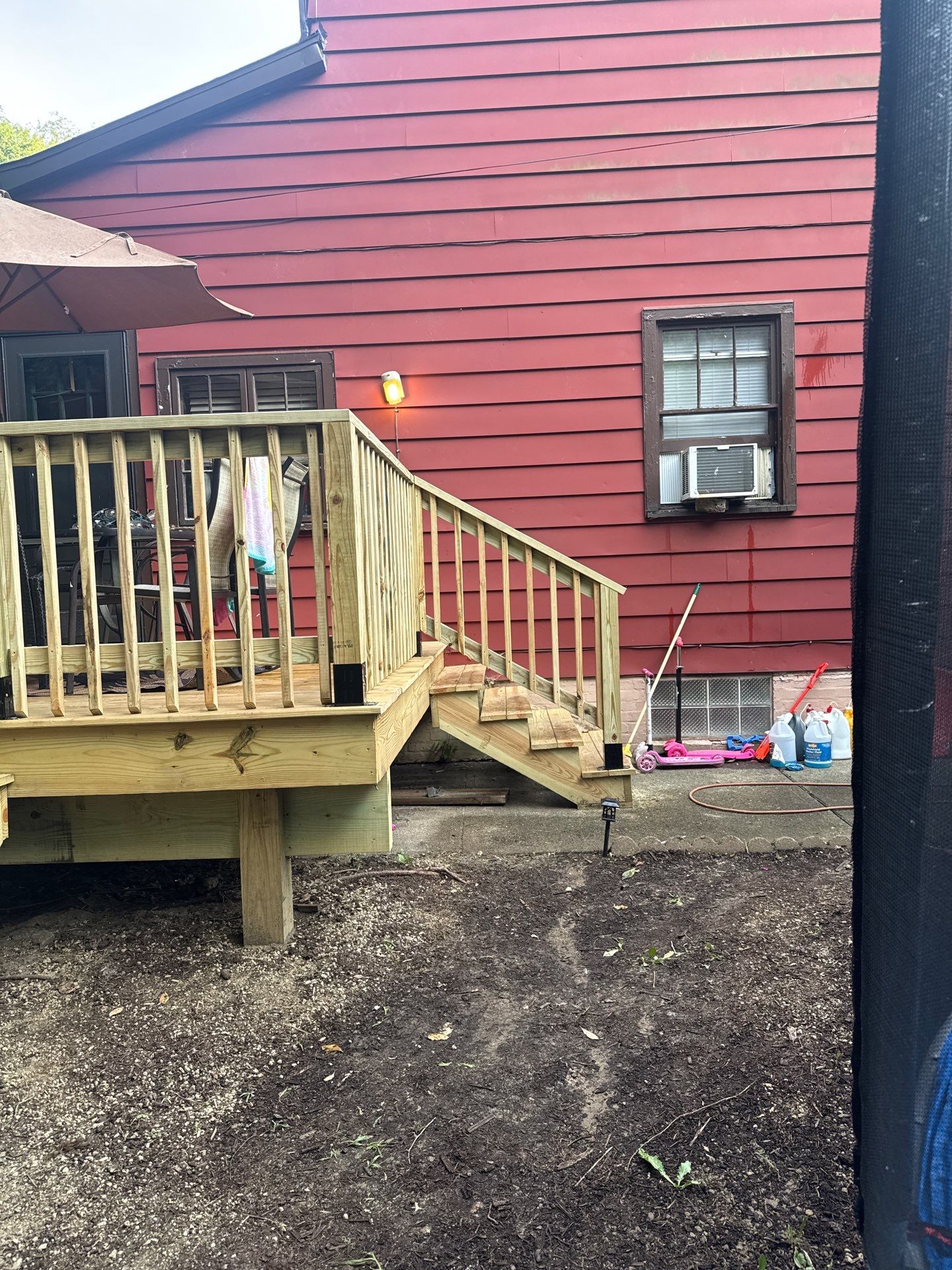 Roof sunspace deck  by Cousins Roofing Siding & Decks