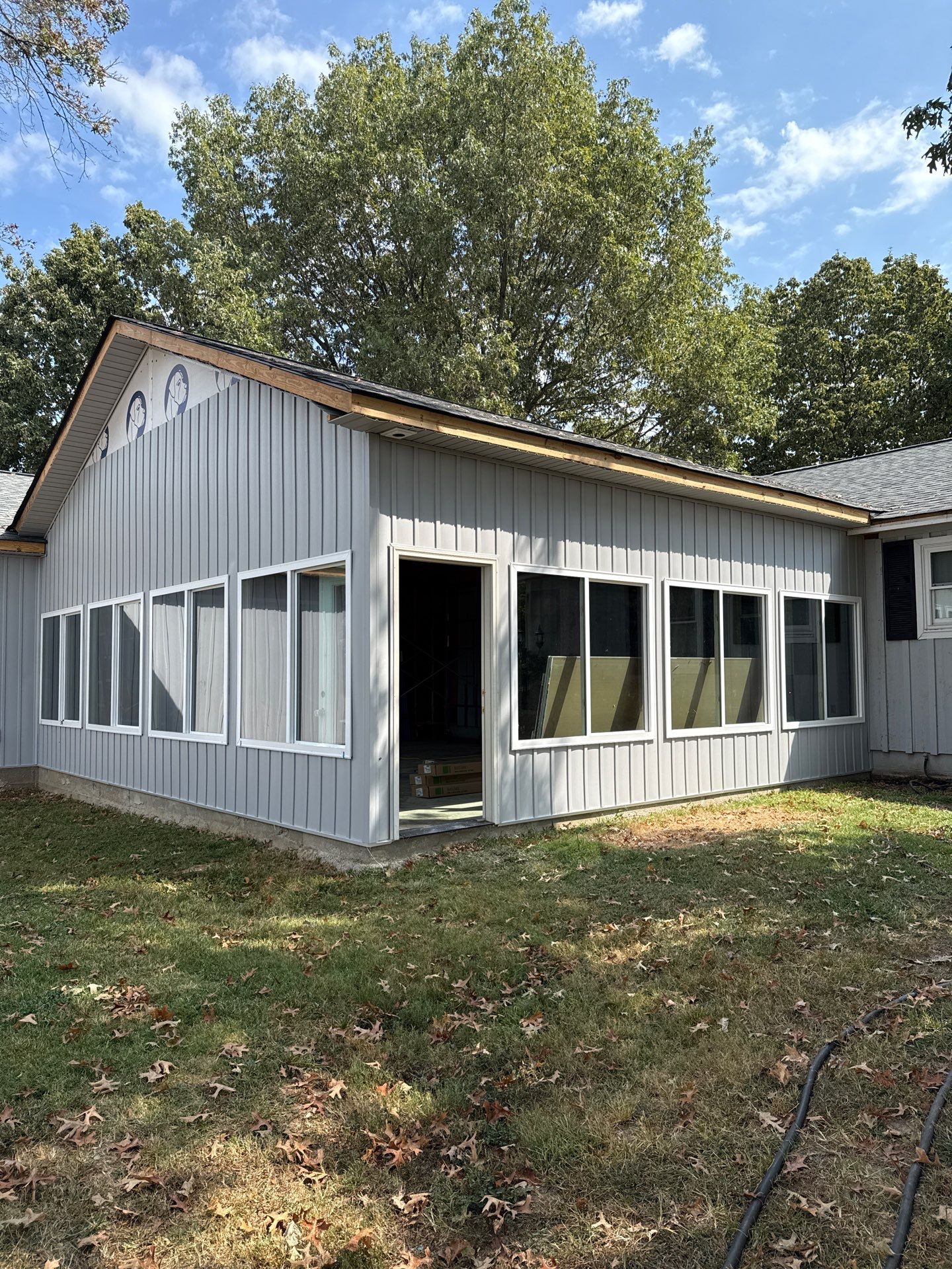 Sunroom and Garage Addition by Skilled Construction LLC