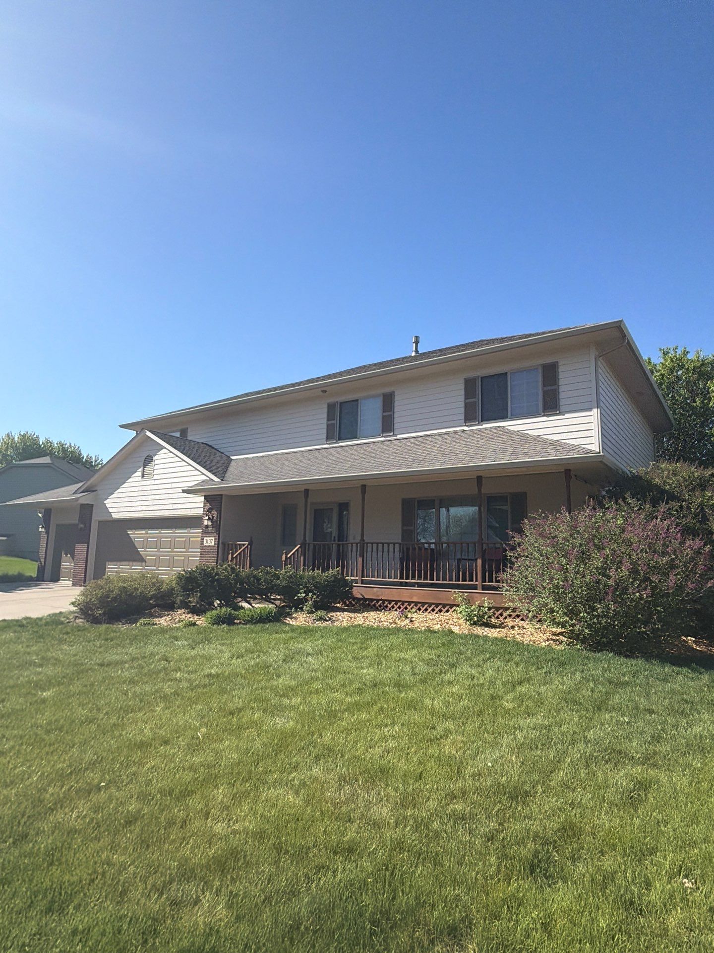Residential Exterior Painting with Shutter and Trim Updates in Sioux Falls by Select Painting, Coatings & Garage Cabinets