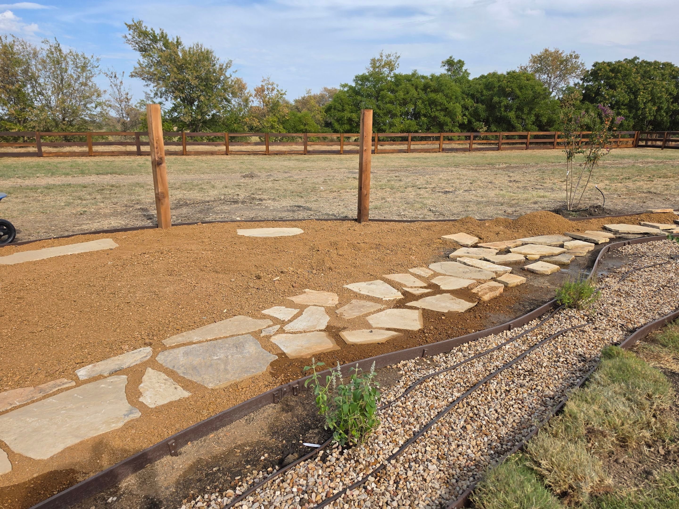 Argyle Residential Landscape Installation with Flagstone Path and Outdoor Seating by Conserva Irrigation NW Dallas