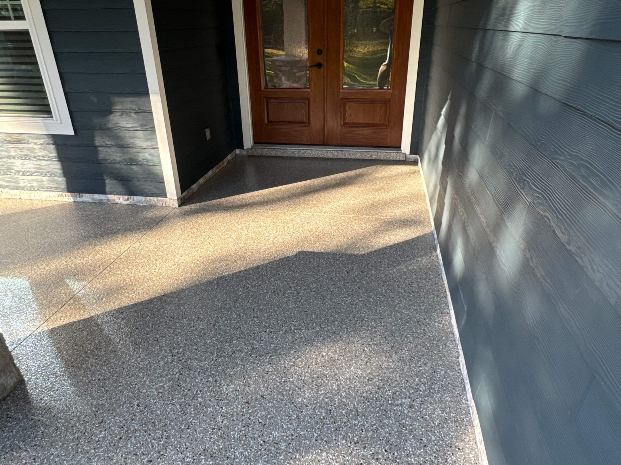 Front and Back Porches in Chiefland, FL in Pebble Beach by Cross Creek Concrete Coatings