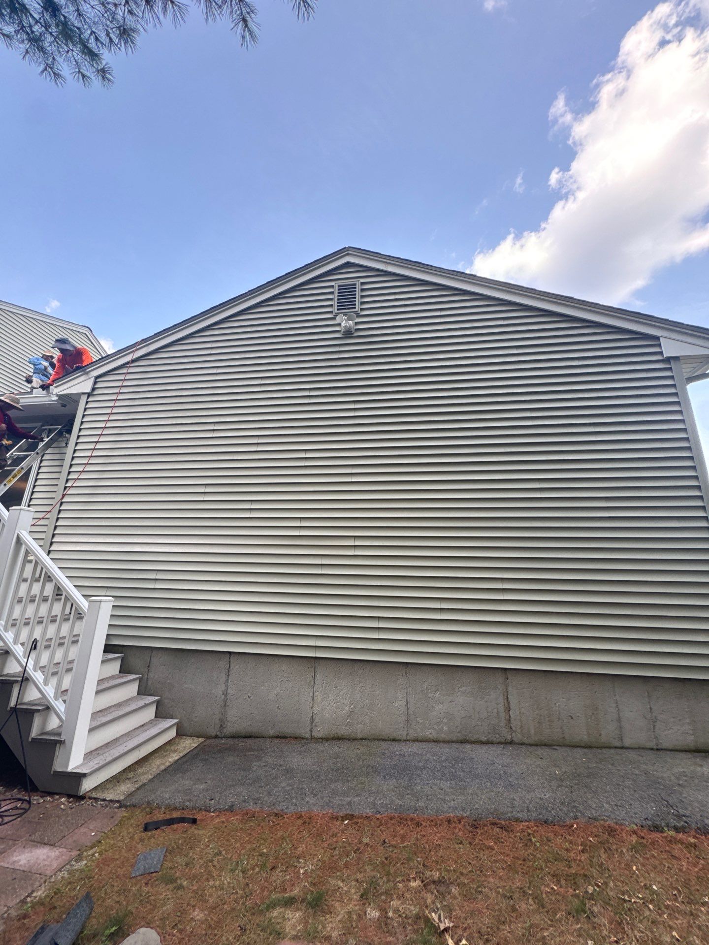 Complete Roof Replacement with Chimney Flashing, Gutter Guard System, and Vinyl Siding Repairs by Mighty Dog Roofing of Greater Middlesex County