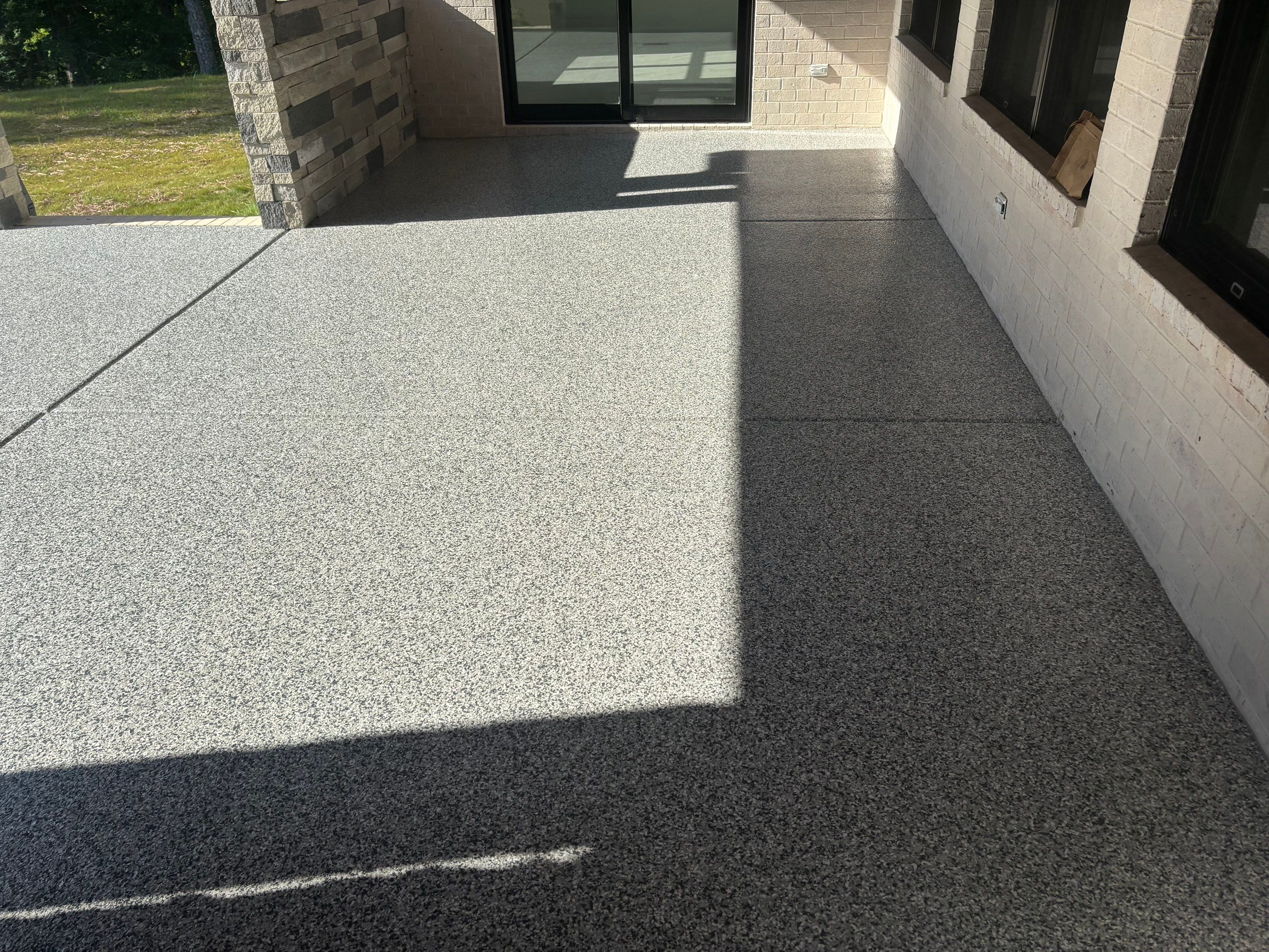 Porch & Garage Using Tidal Wave & Gravel  by Elite Floor Solutions