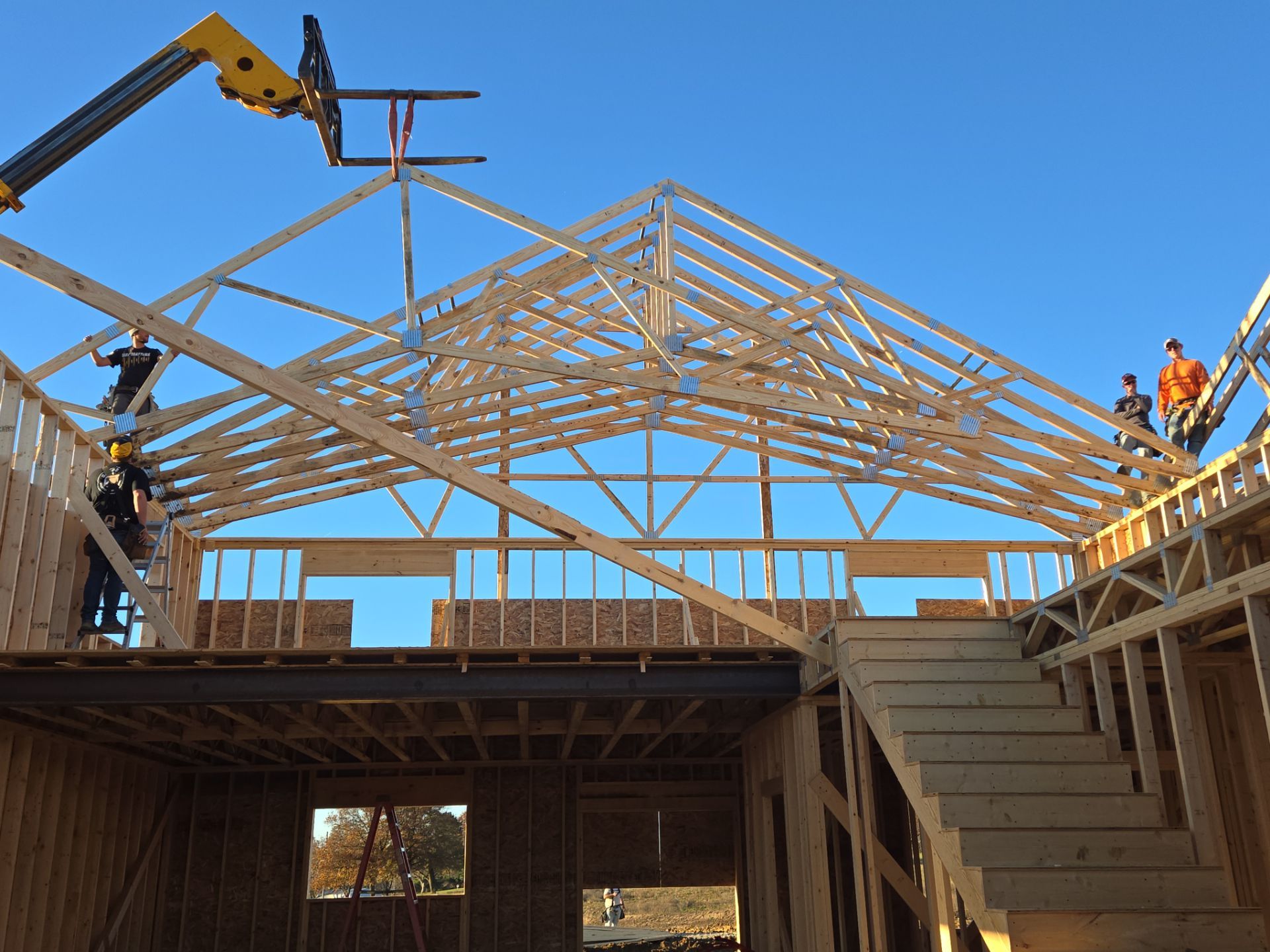 New Home construction w/ board and batten sides and metal roof  by Miles Construction 