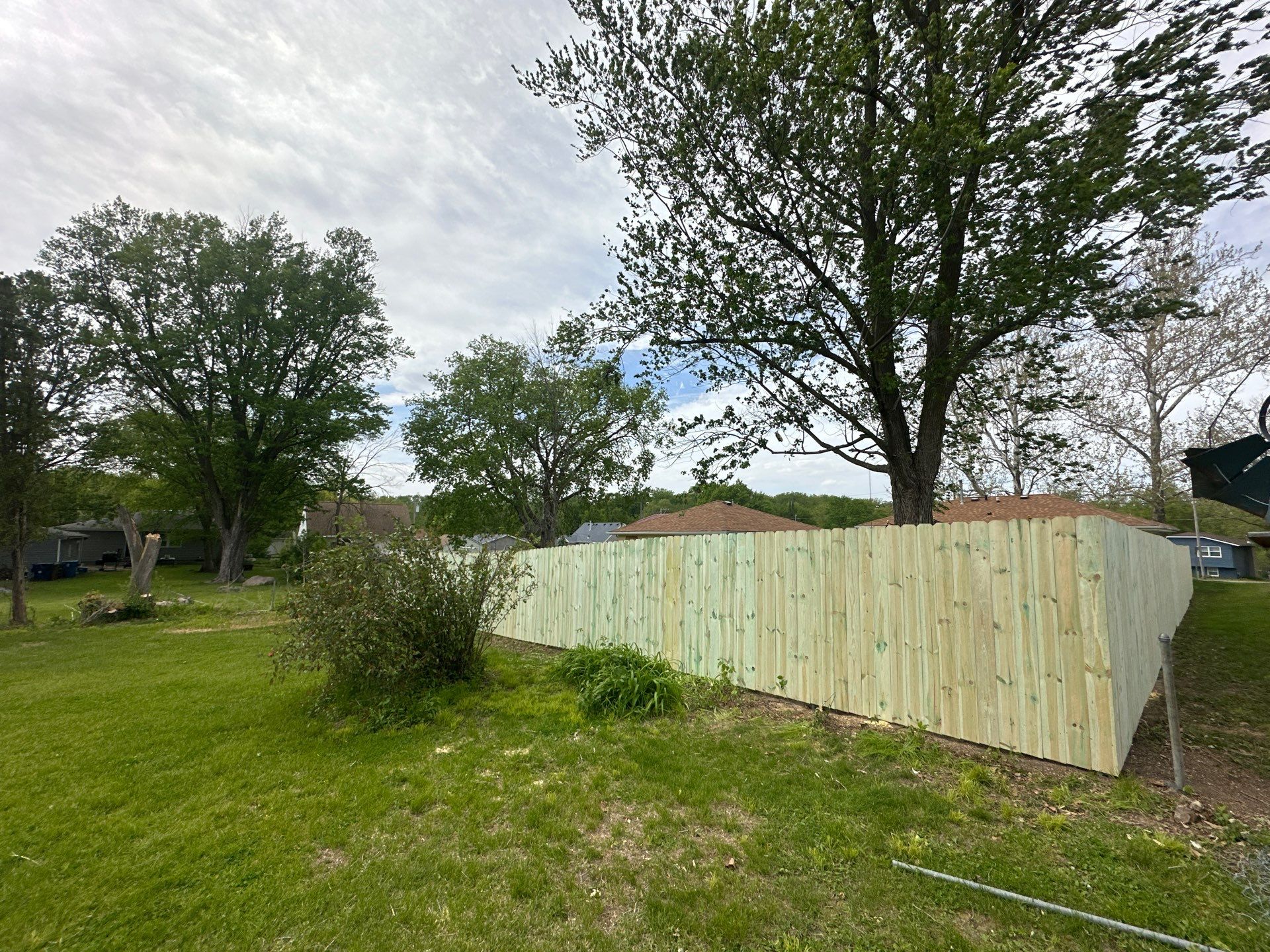 Pressure-Treated Wood Privacy Fence Installation in Waterloo by Perfect Picket Fence and Stain