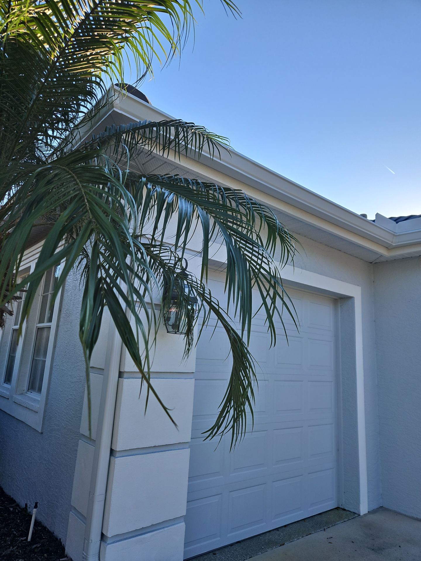 White Down Spouts using downspouts and White Seamless Gutters in Sarasota FL by Gutter Professors