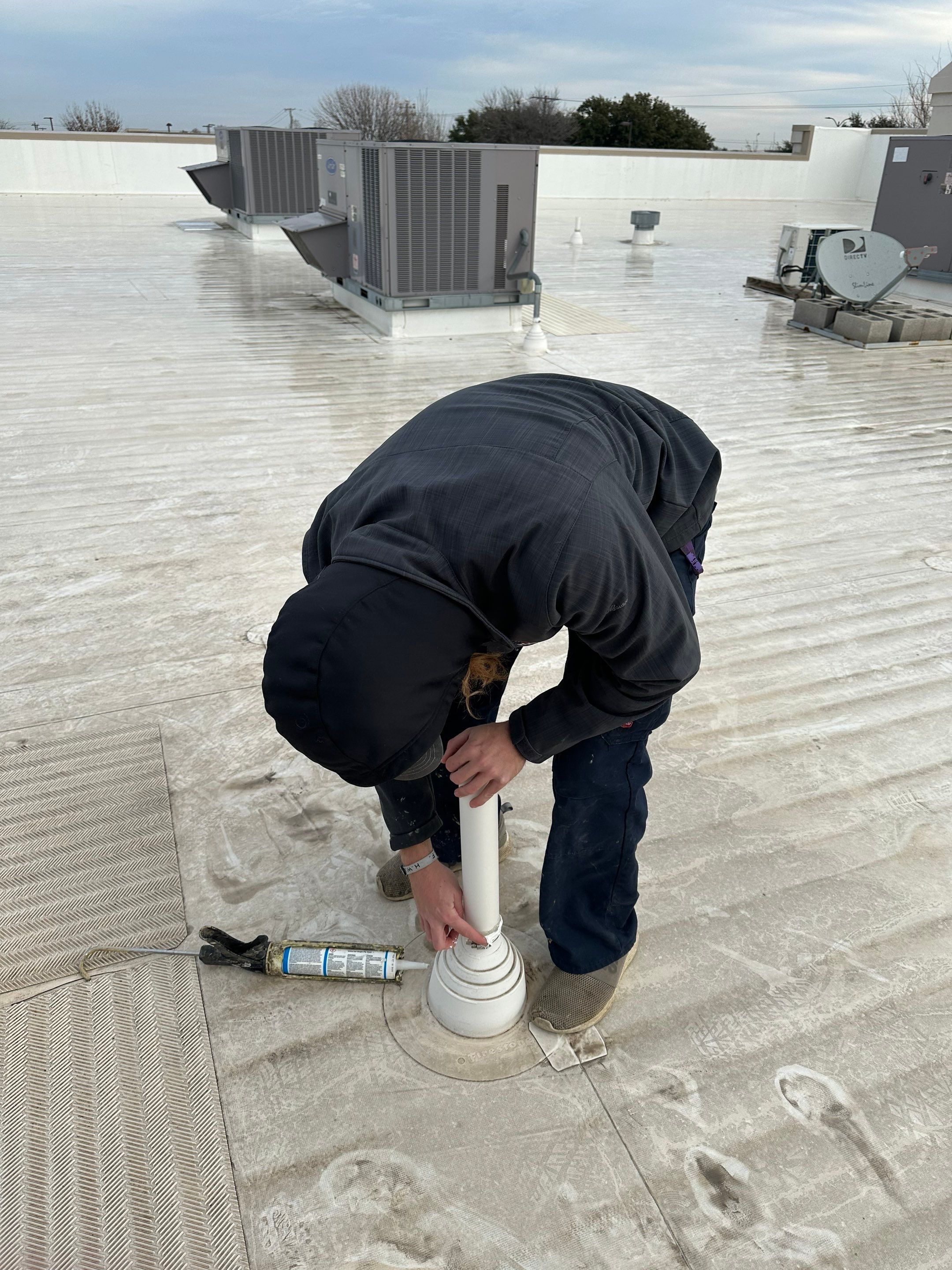 Commercial Roofing Repair using Re-Seal Pipe Flashing by OneSource Roofing and Restoration