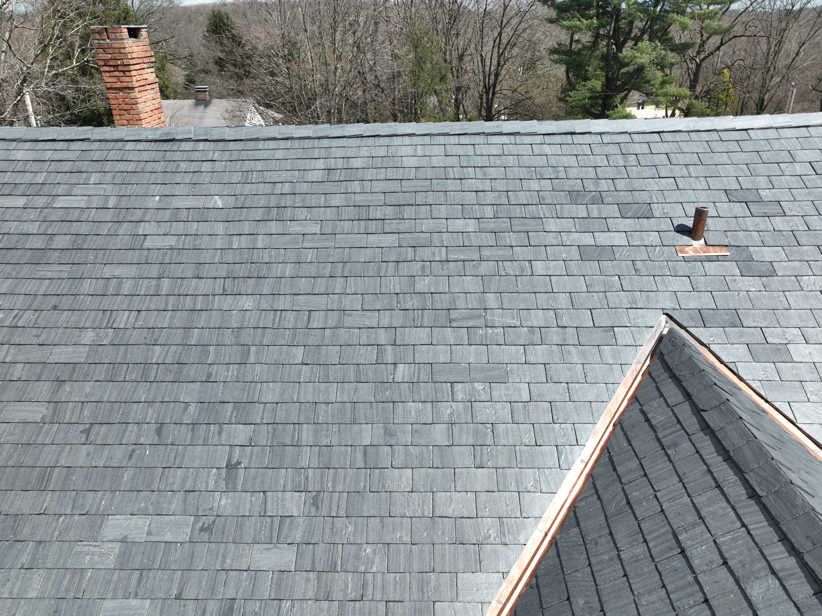 Residential Roofing Installation using Vermont Slate by A Plus Exterior