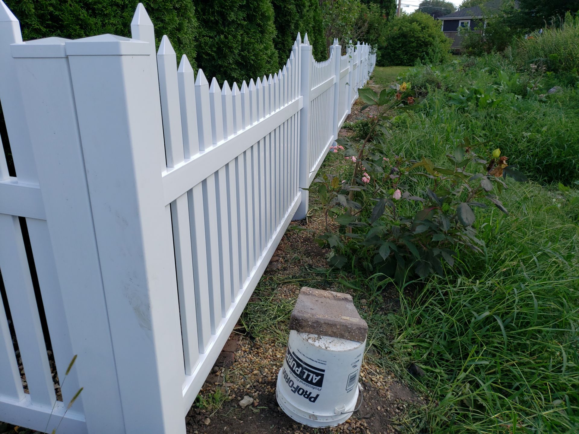 White Vinyl Spaced Picket Fence Installation in Waterloo by Perfect Picket Fence and Stain
