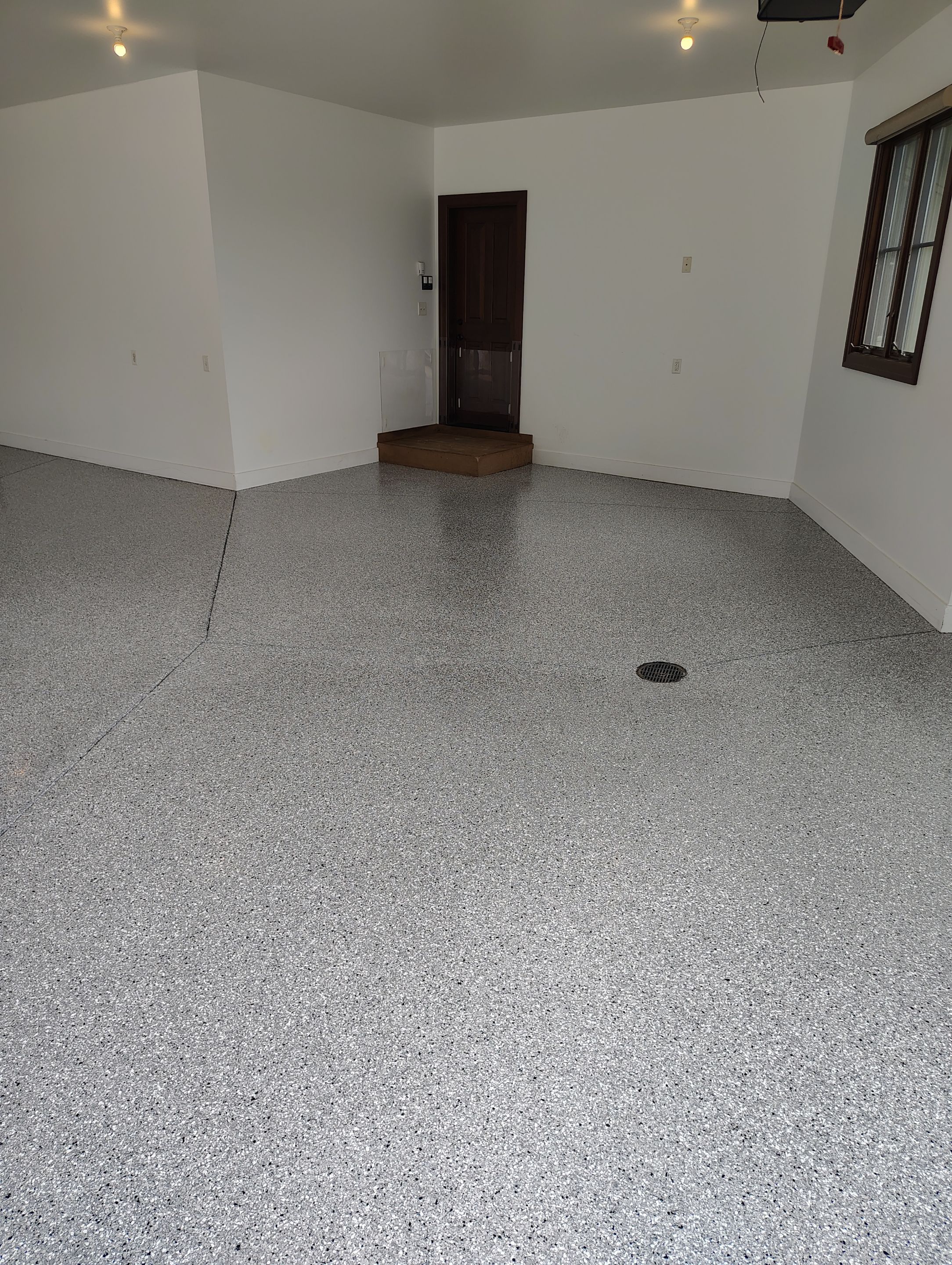 Feather Grey Floor Coating in Sioux Falls, SD by Select Painting, Coatings & Garage Cabinets