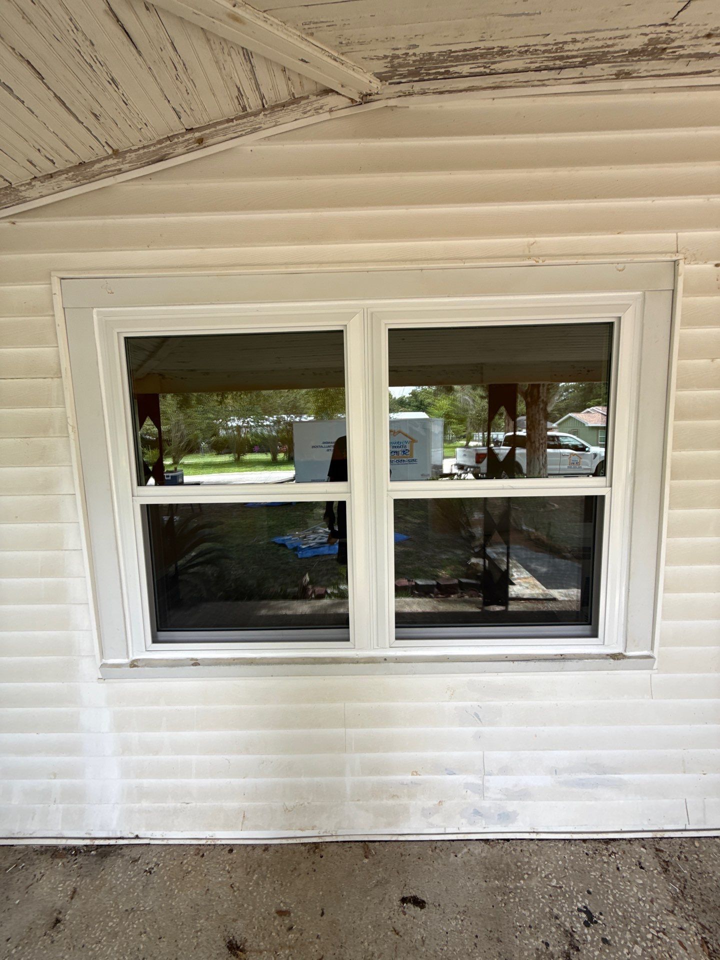 White Vinyl Window Replacement for Residential Home in Williston by Windows & Doors Store