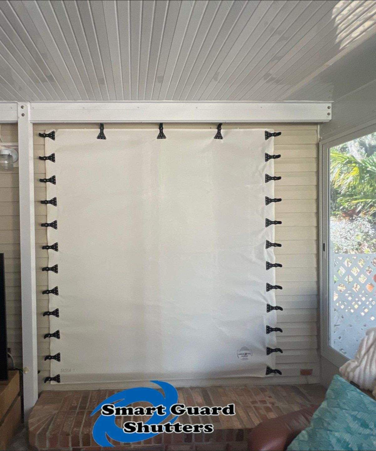 Accordion Shutters & Hurricane Fabric by Smart Guard Shutters