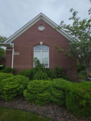 Siding and Trim Repair and Exterior Painting for a Macomb Brick Residence