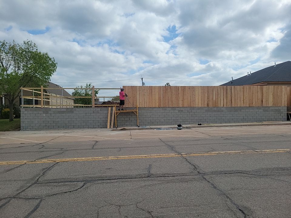 Cedar Fence using Cedar Pickets and Metal Poles by Clays Services Inc