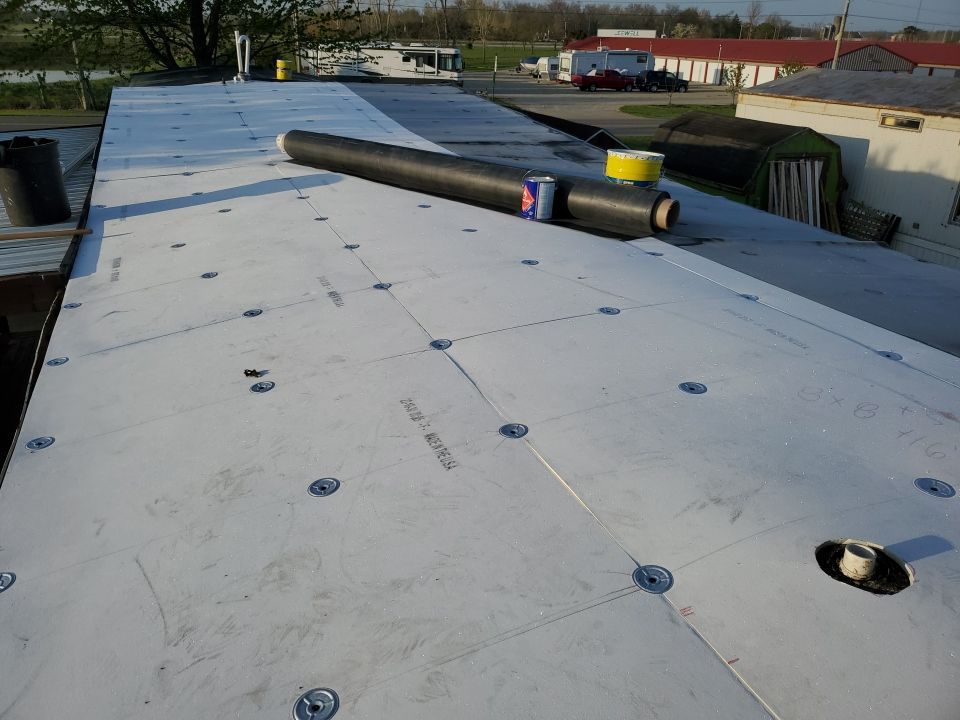 Residential Roofing Installation using 60 mil rubber roof  by Nitro Roofing and Construction